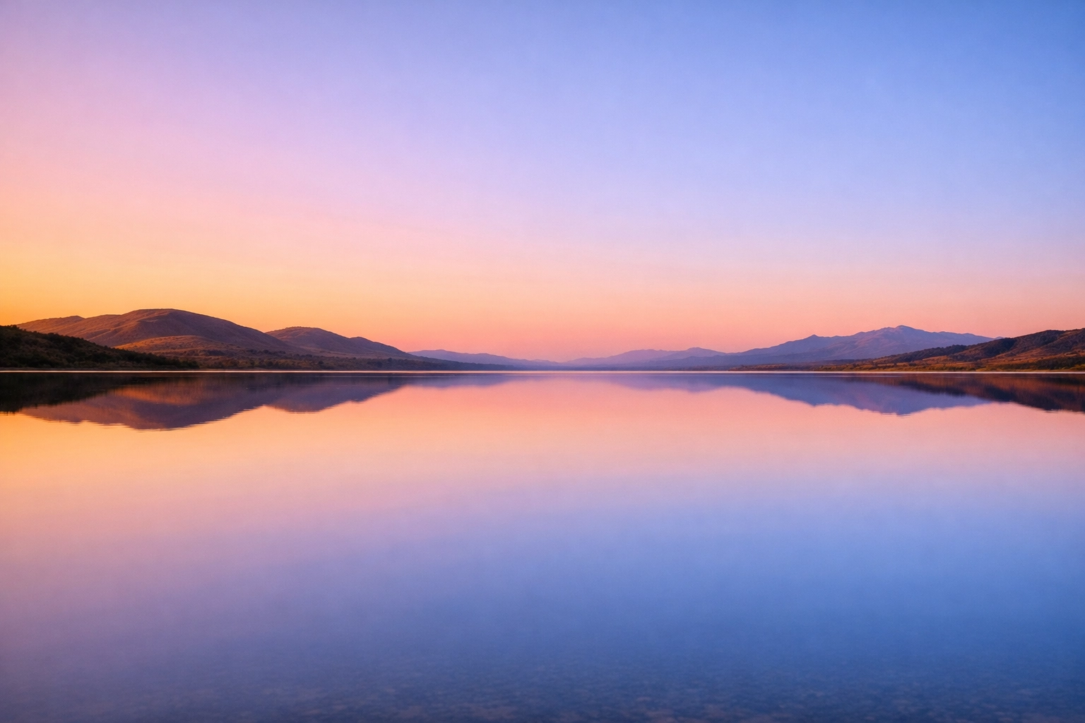A peaceful lake reflection at sunset representing the serenity of a consistent prayer life.