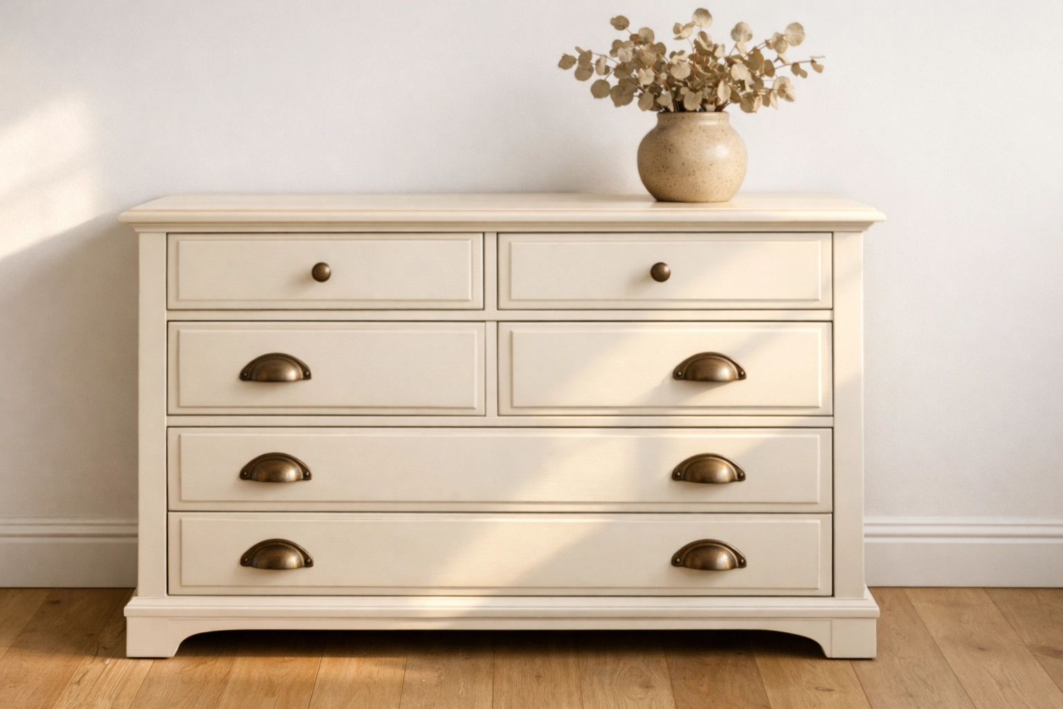 Vintage dresser painted in warm Cloud Dancer off-white with a matte finish for a cozy room.