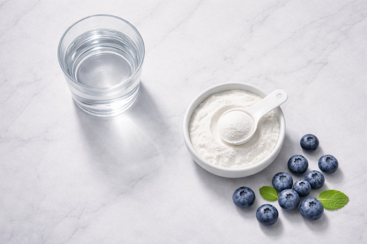 Bowl of creatine powder, water, and blueberries representing hydration and healthy supplementation for women