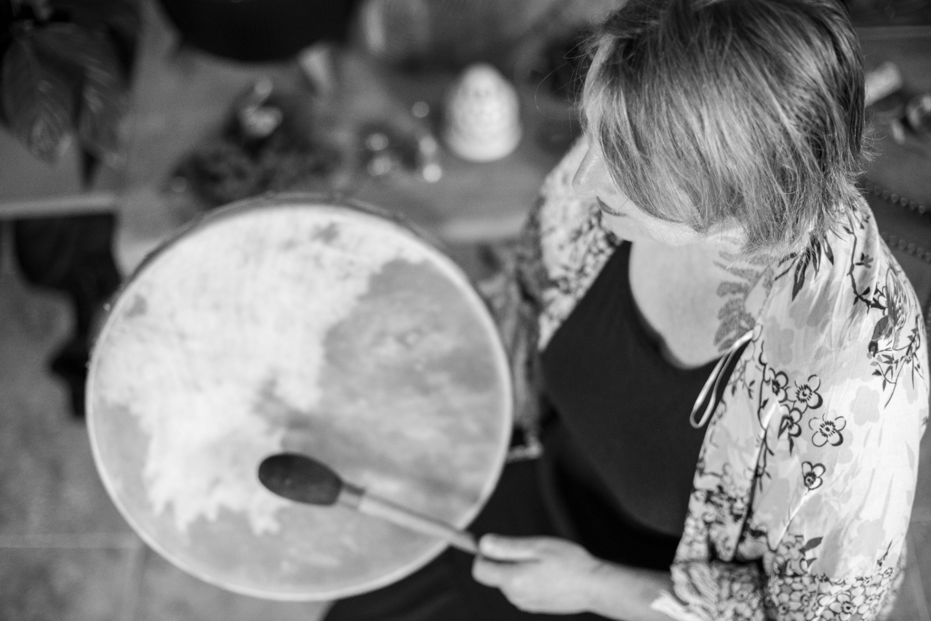 Facilitator with frame drum in ritual Facilitator with frame drum in ritual