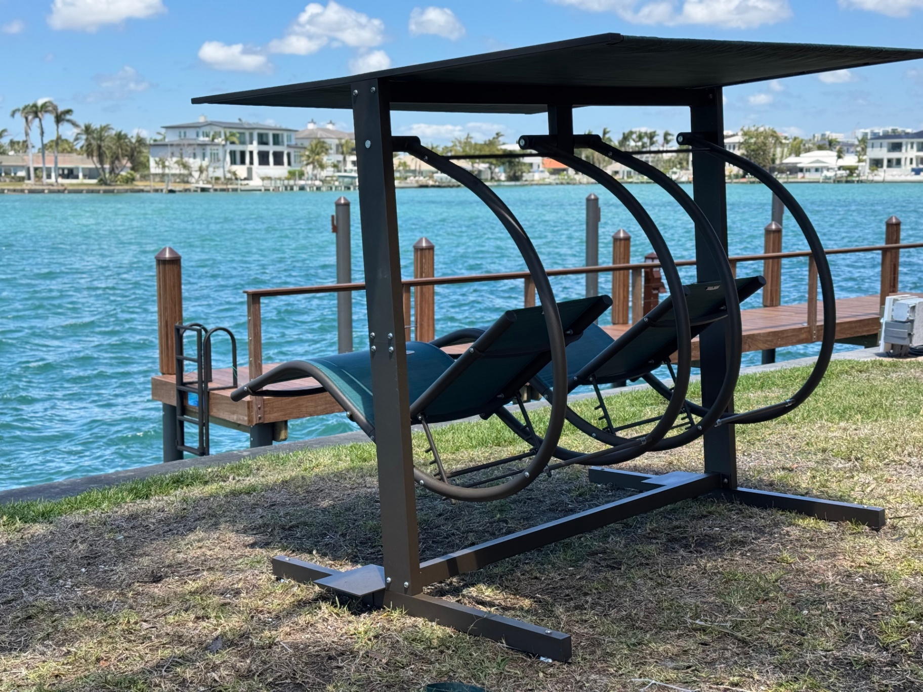 Zero Gravity Swing in aqua blue by the poolside.