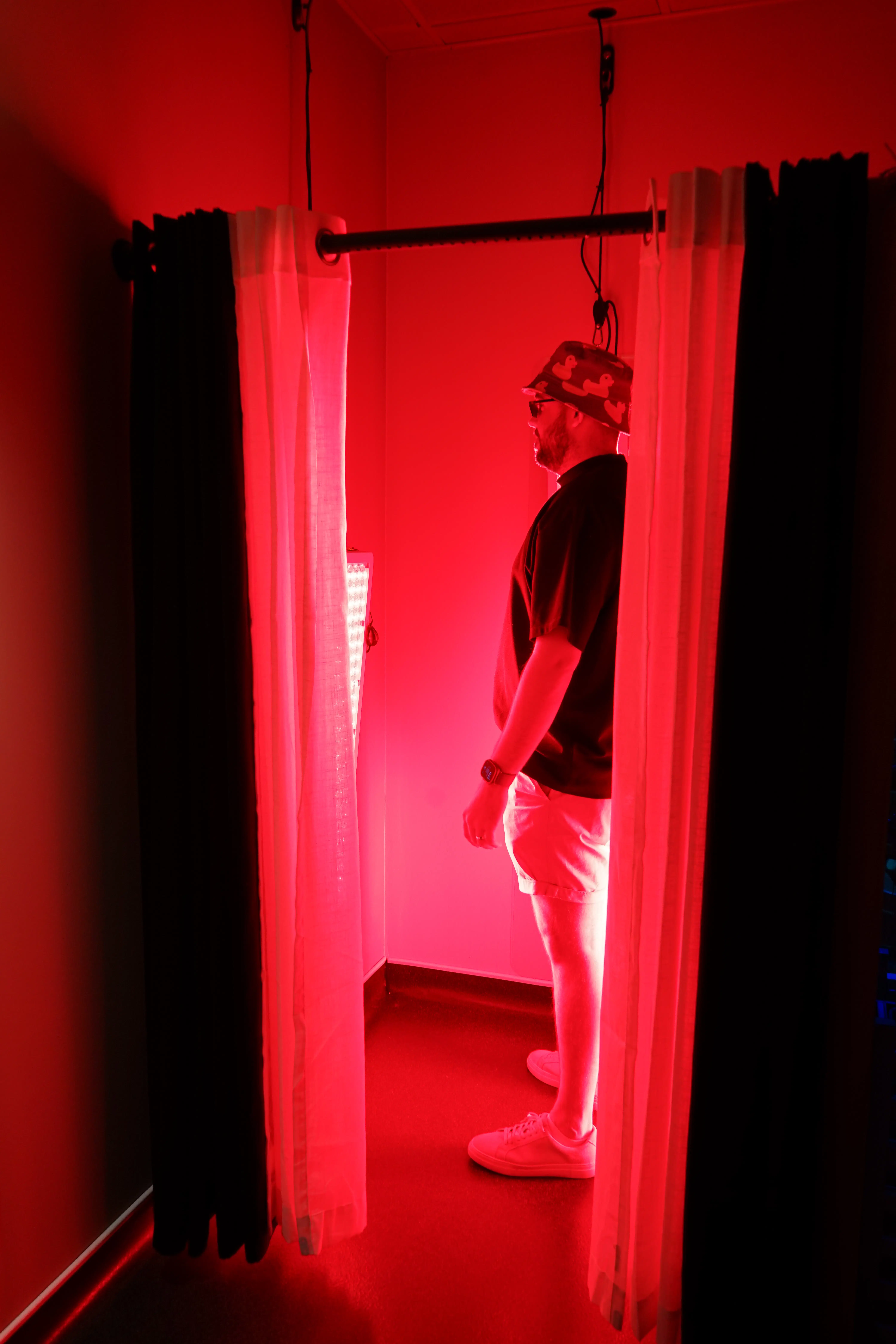 client-receiving-red-light-therapy-in-private-booth.webp