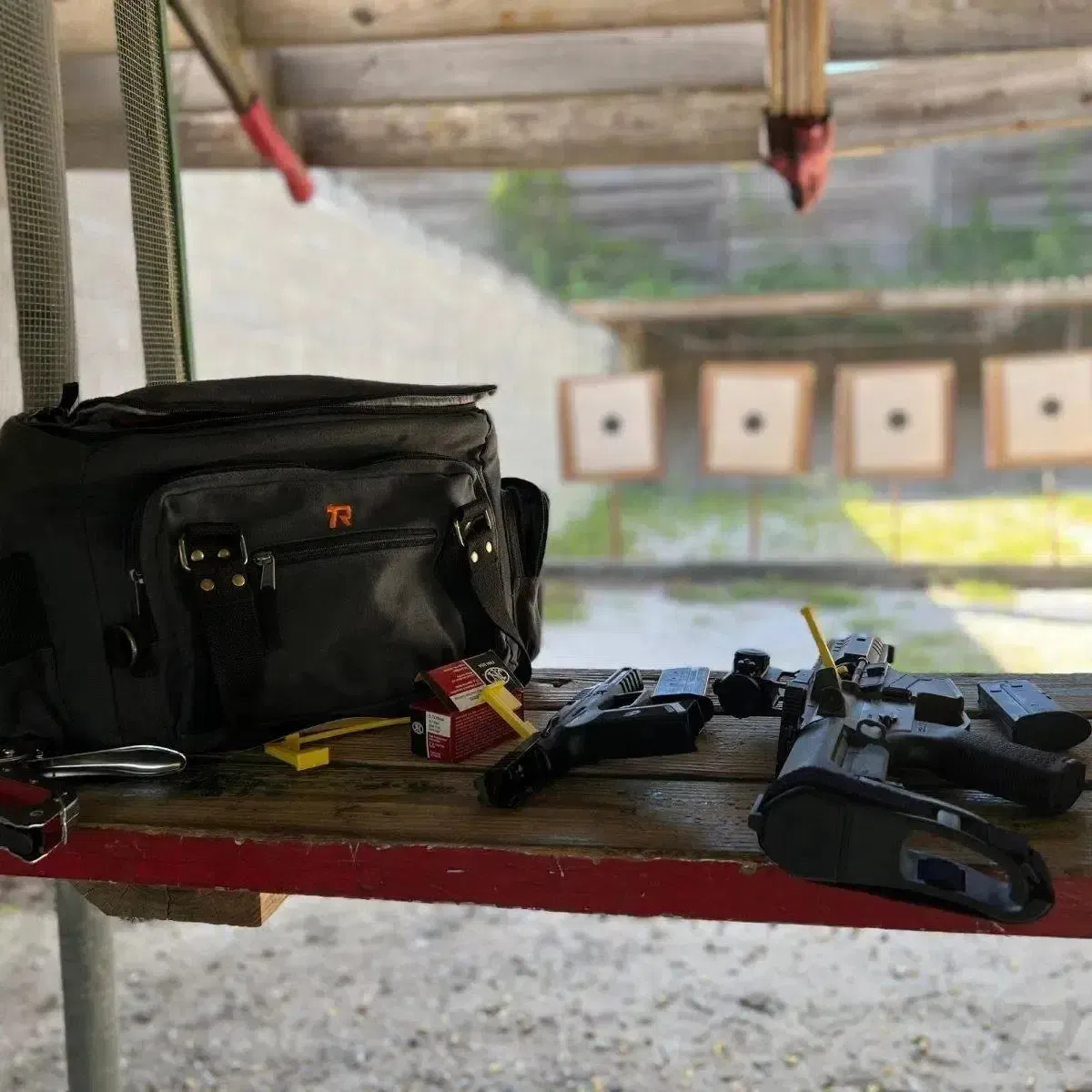 Range bench setup featuring a tactical range bag and gear