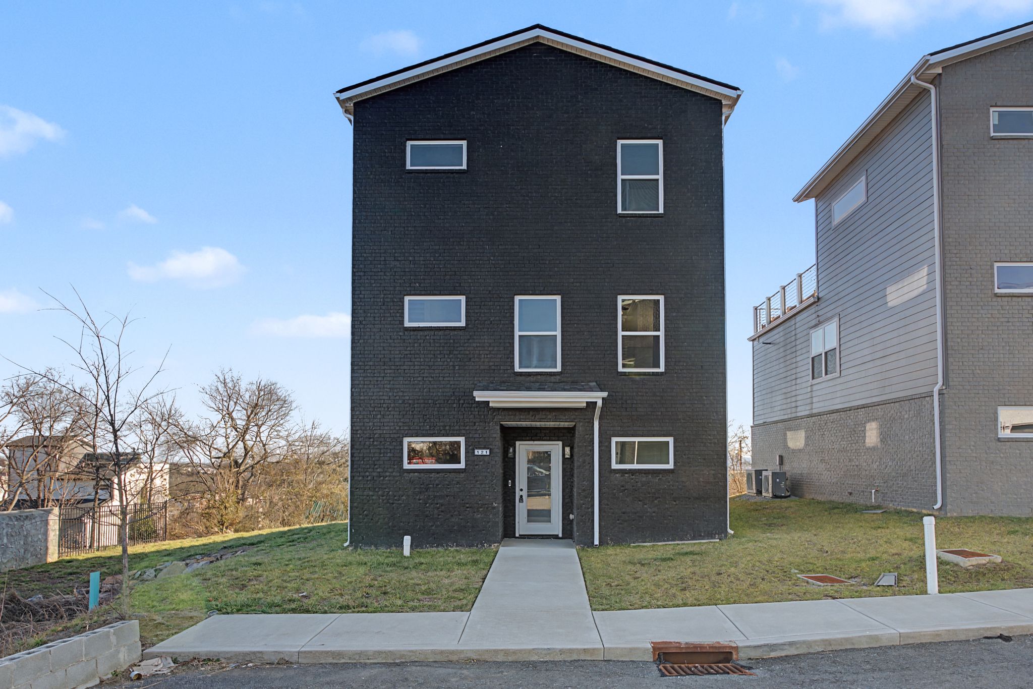 Contemporary black brick home in Nashville showing the type of inventory available