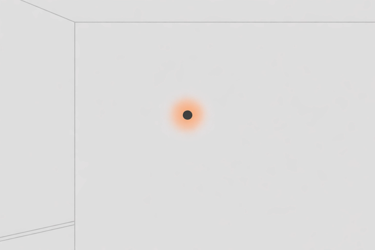 A small nail hole in a grey wall needing professional drywall repair in South Main St.