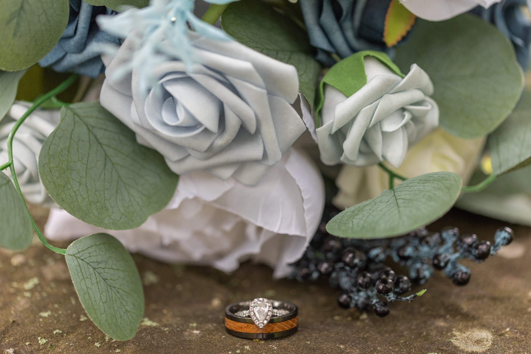 Close-up of wedding bouquet and rings
