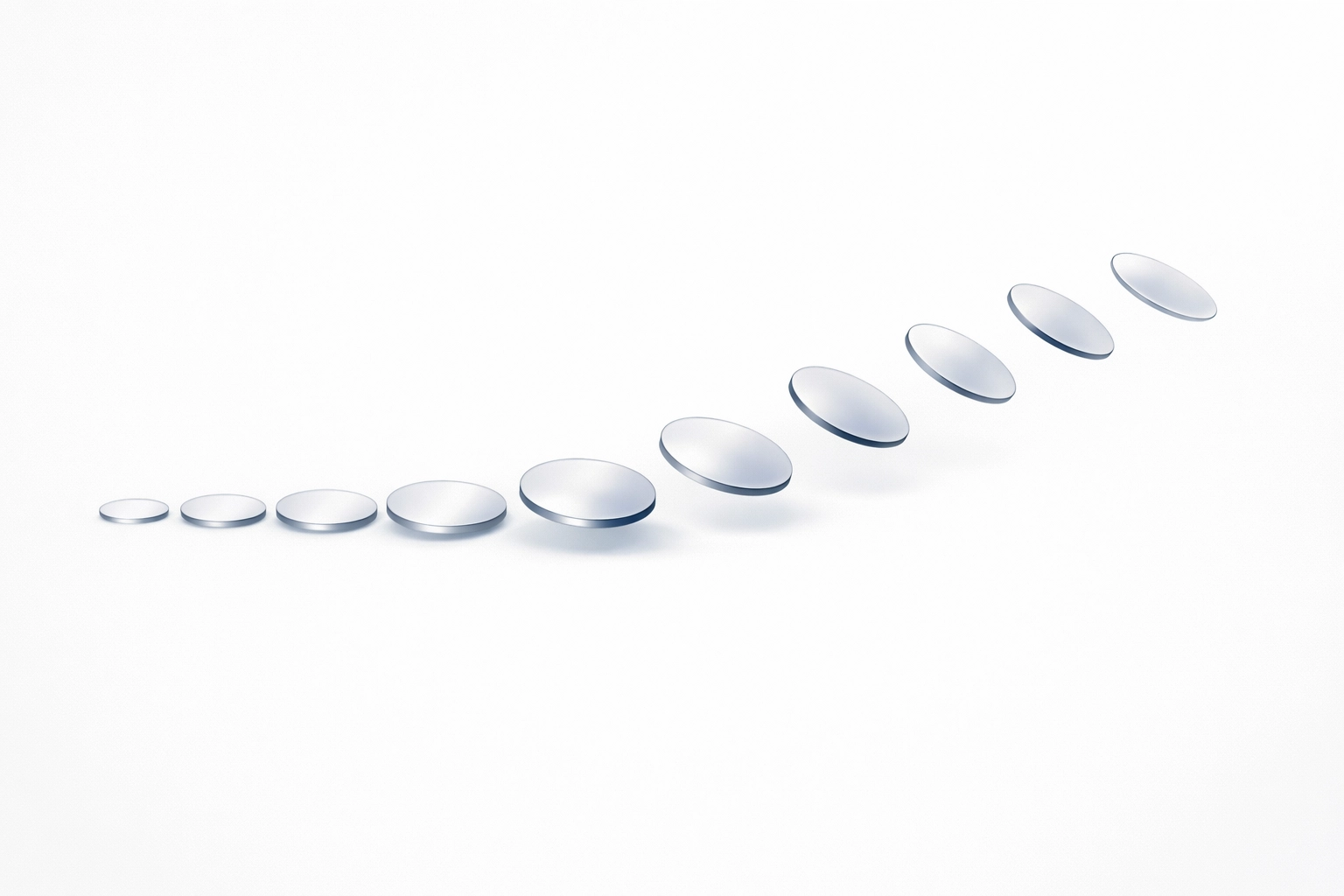 A sequence of silver discs showing model drift and degradation in AI system performance over time.