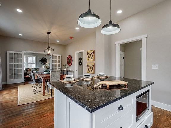 Modern remodeled kitchen showing off craftsmanship and updated lighting