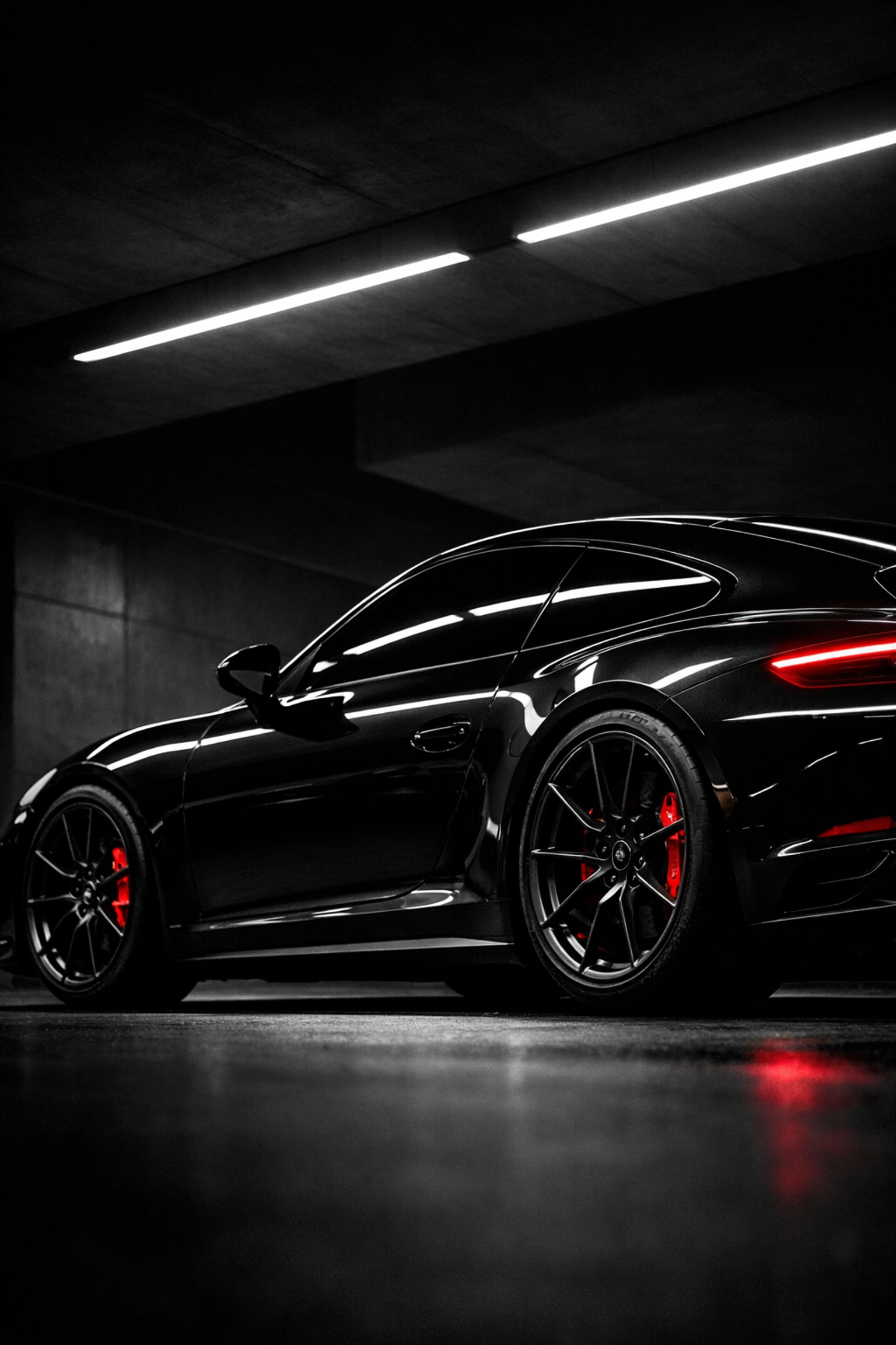 High-performance black sports car showcasing sleek, reflective automotive window tinting.