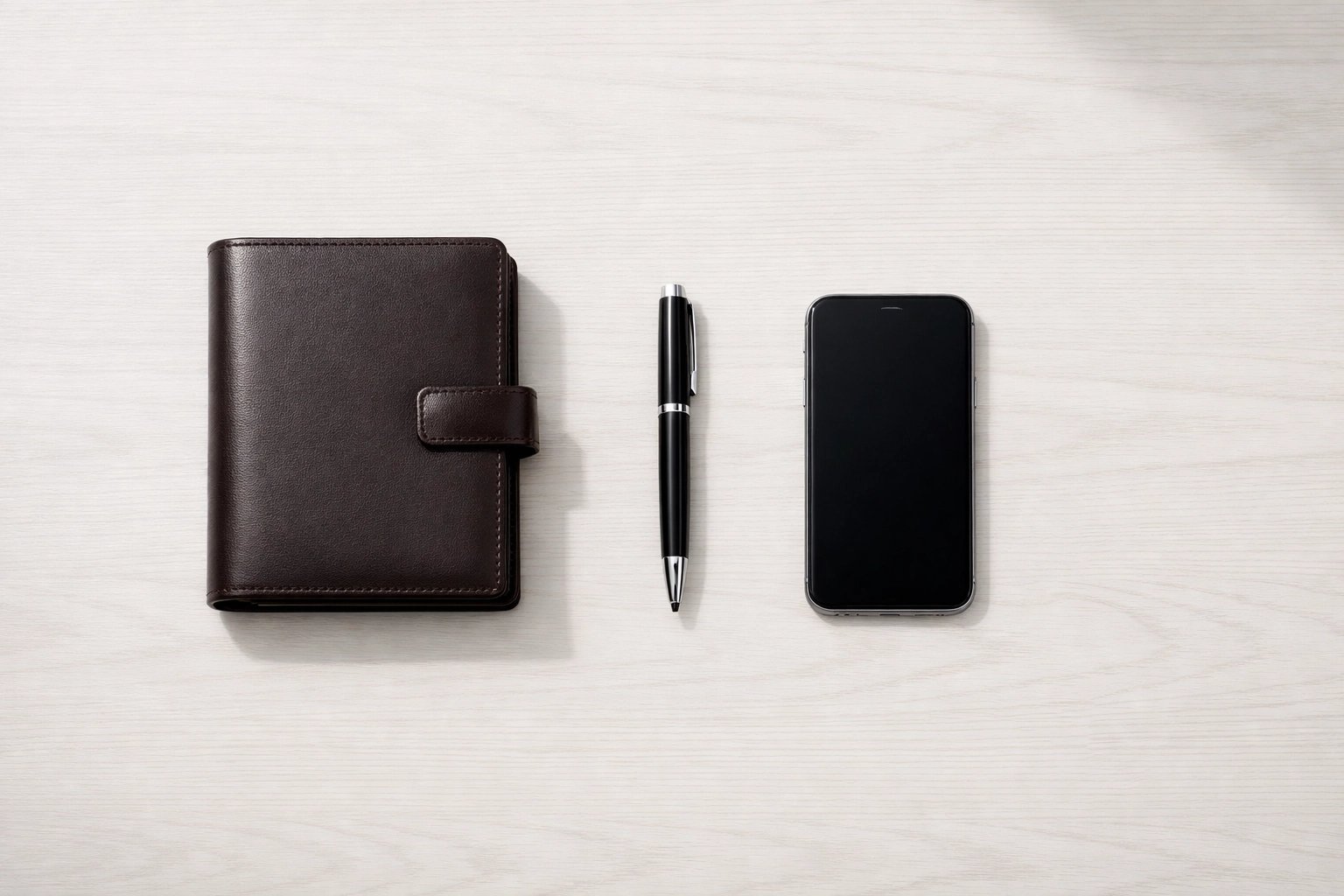 Minimalist desk with planner symbolizing organized new agent training systems in Houston real estate.