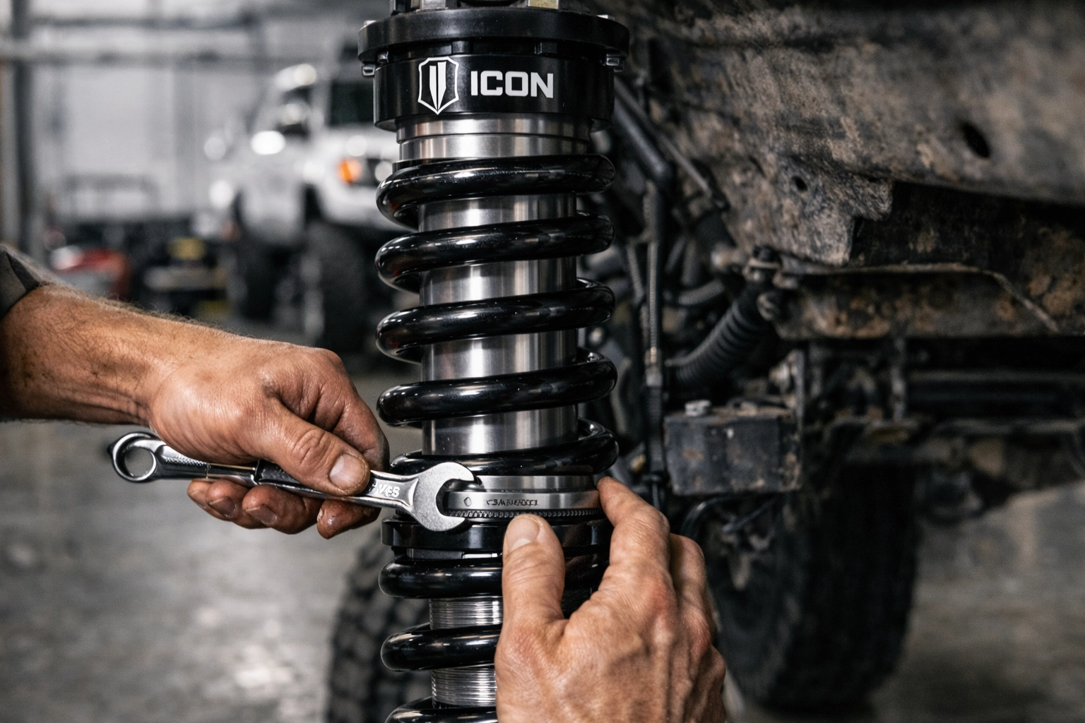 Expert installation of an ICON suspension lift kit at Sexton Offroad's 4x4 shop in Utah.