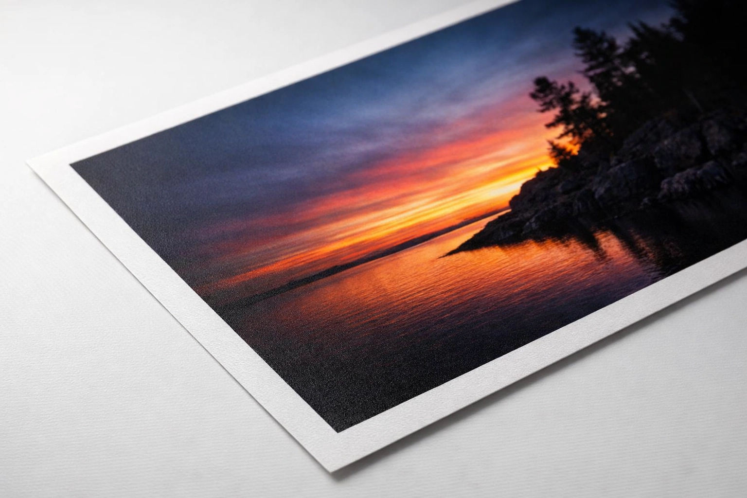 Close-up of baryta paper surface showing smooth matte finish for giclée printing