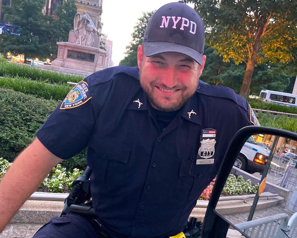 A uniformed NYPD officer representing experienced law enforcement professionals who benefit from C\&G Solutions