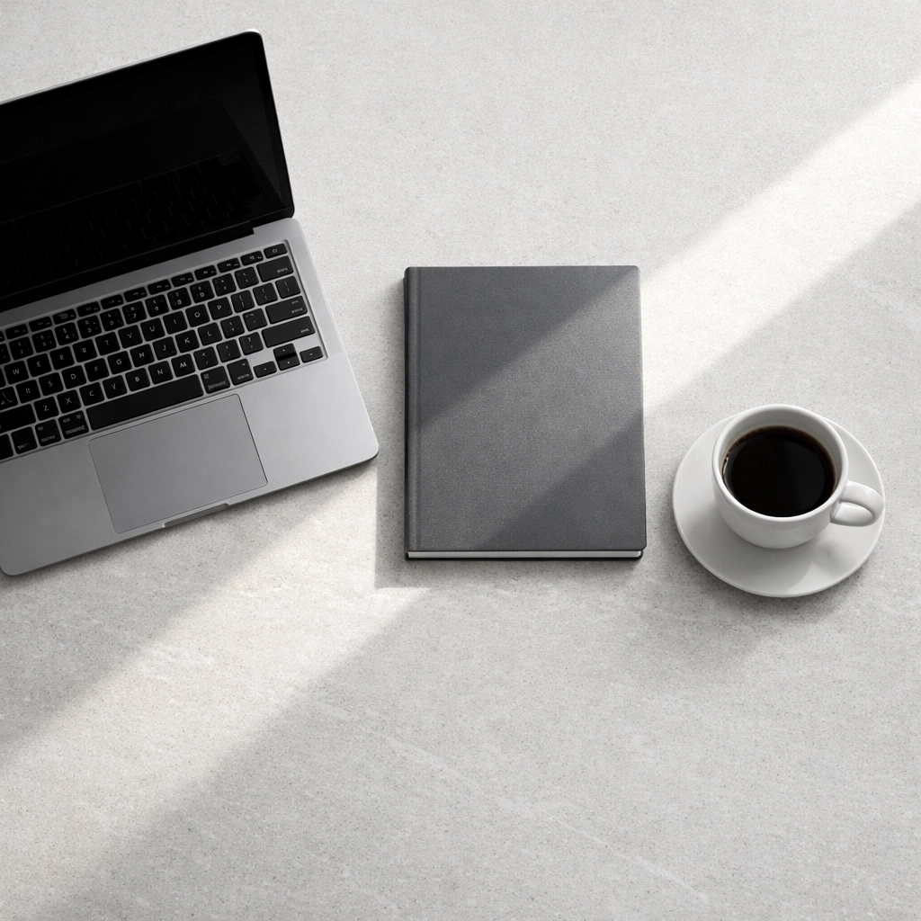 Boutique hotel workspace with a laptop used for analyzing channel manager data and revenue trends.