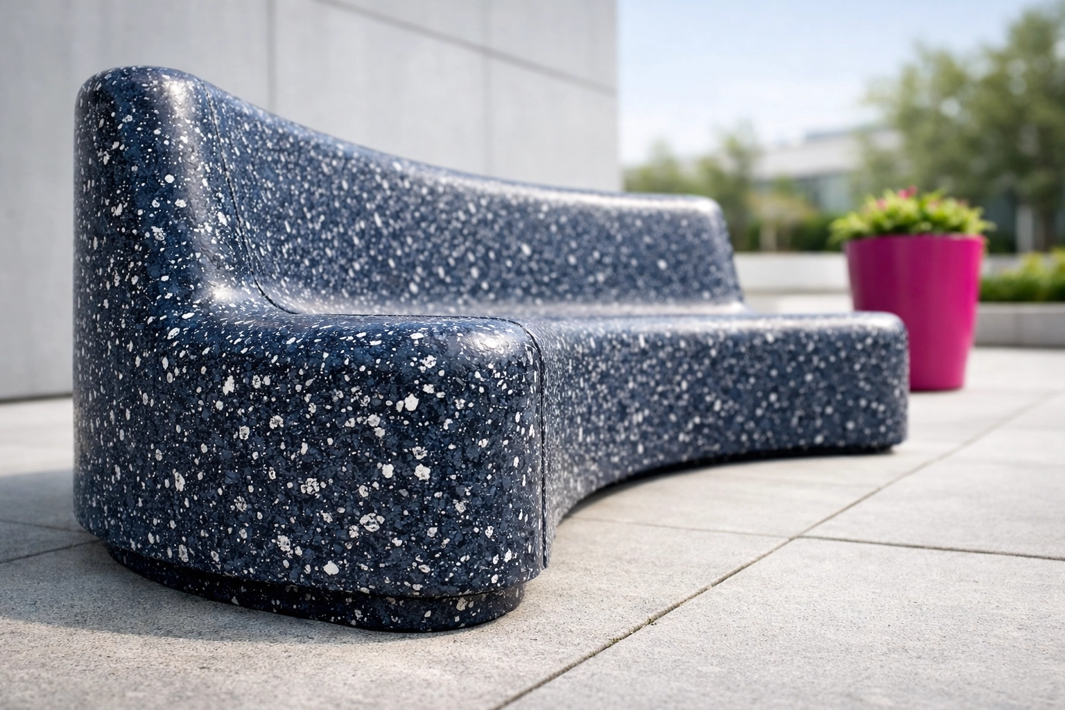 Modern outdoor seat made from speckled recycled plastic, showing a durable and sustainable public design.