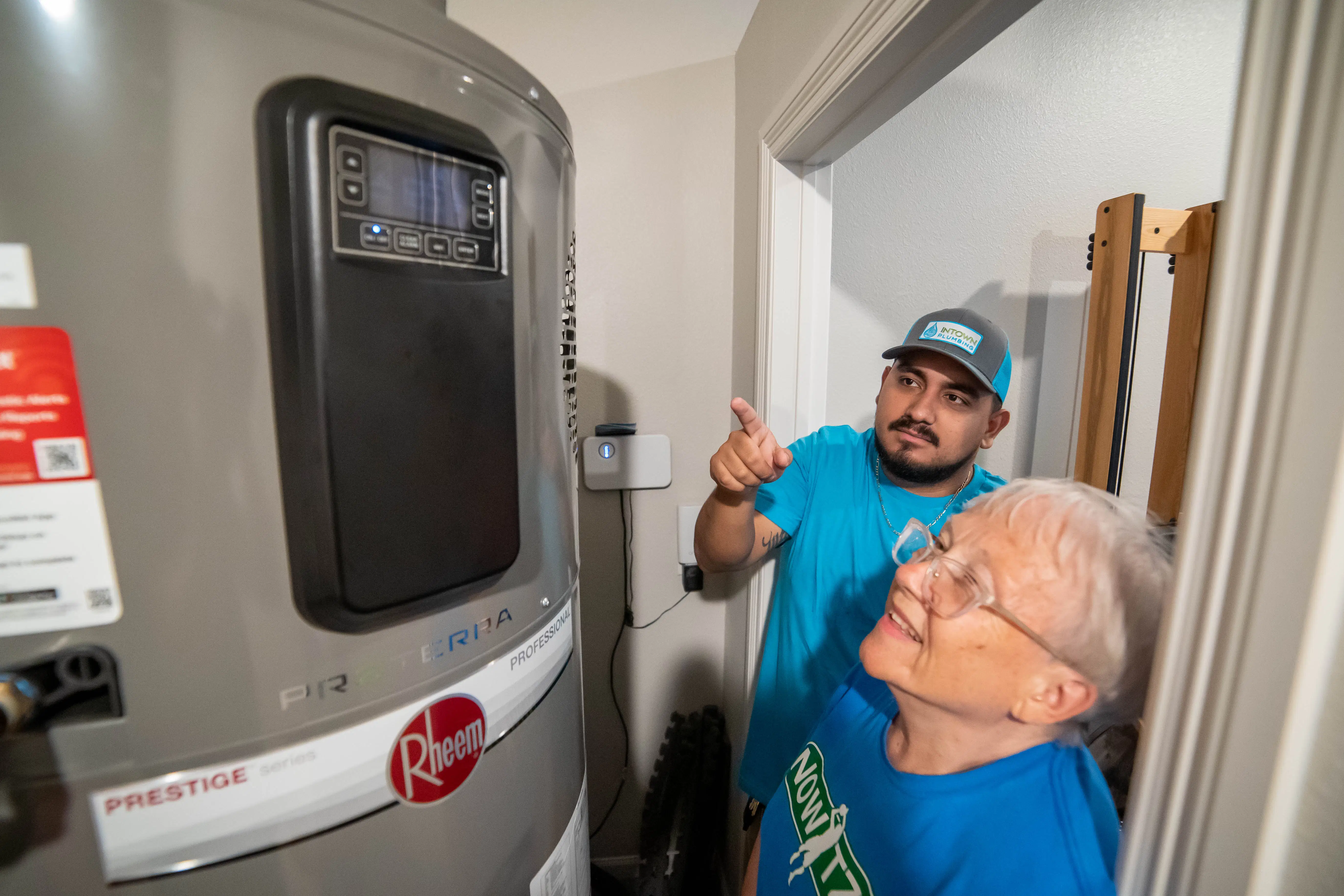 Technician Explaining Rheem Prestige Series Water Heater
