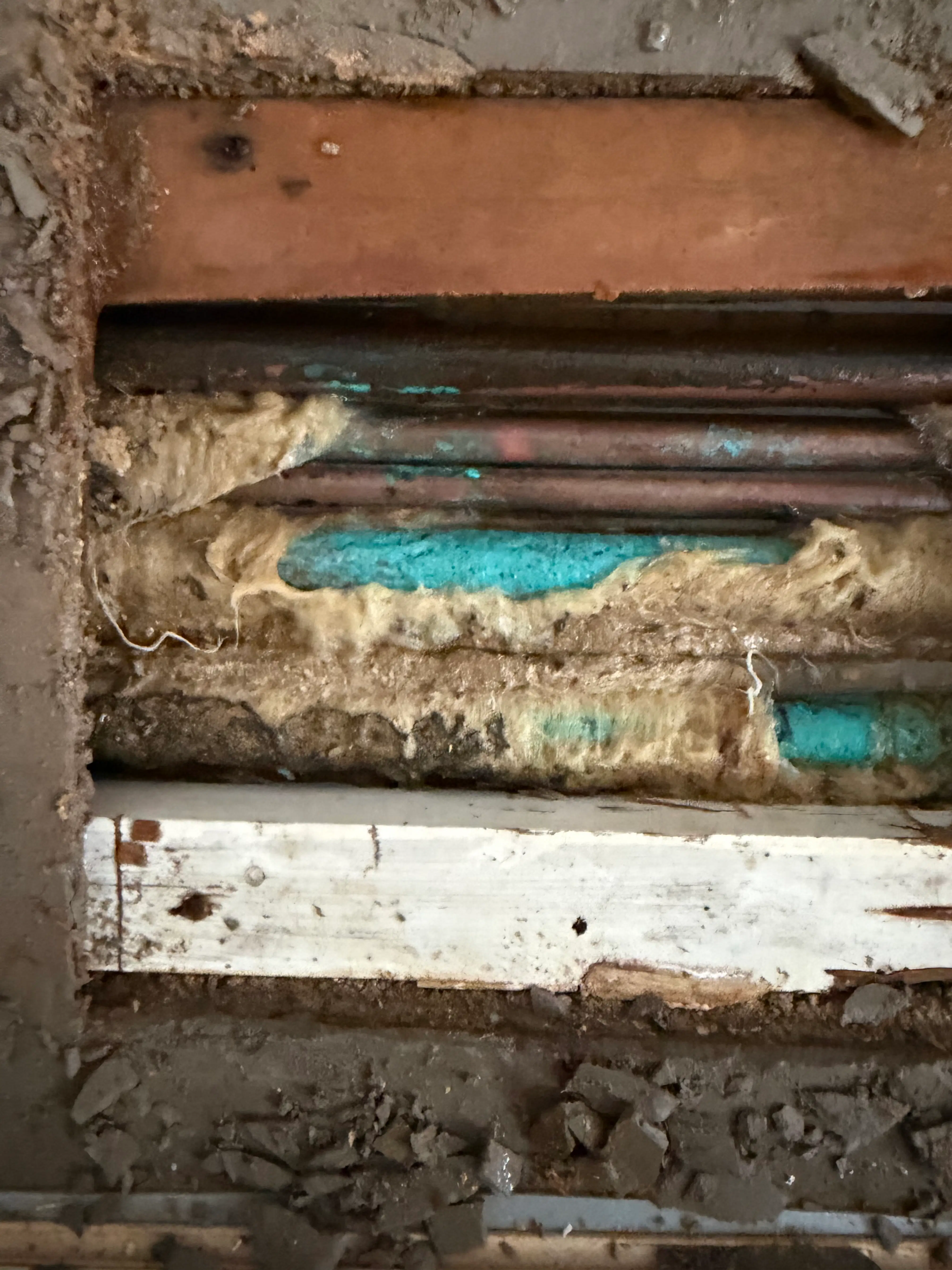Real Aldershot job photo: exposed pipework during the water main repair