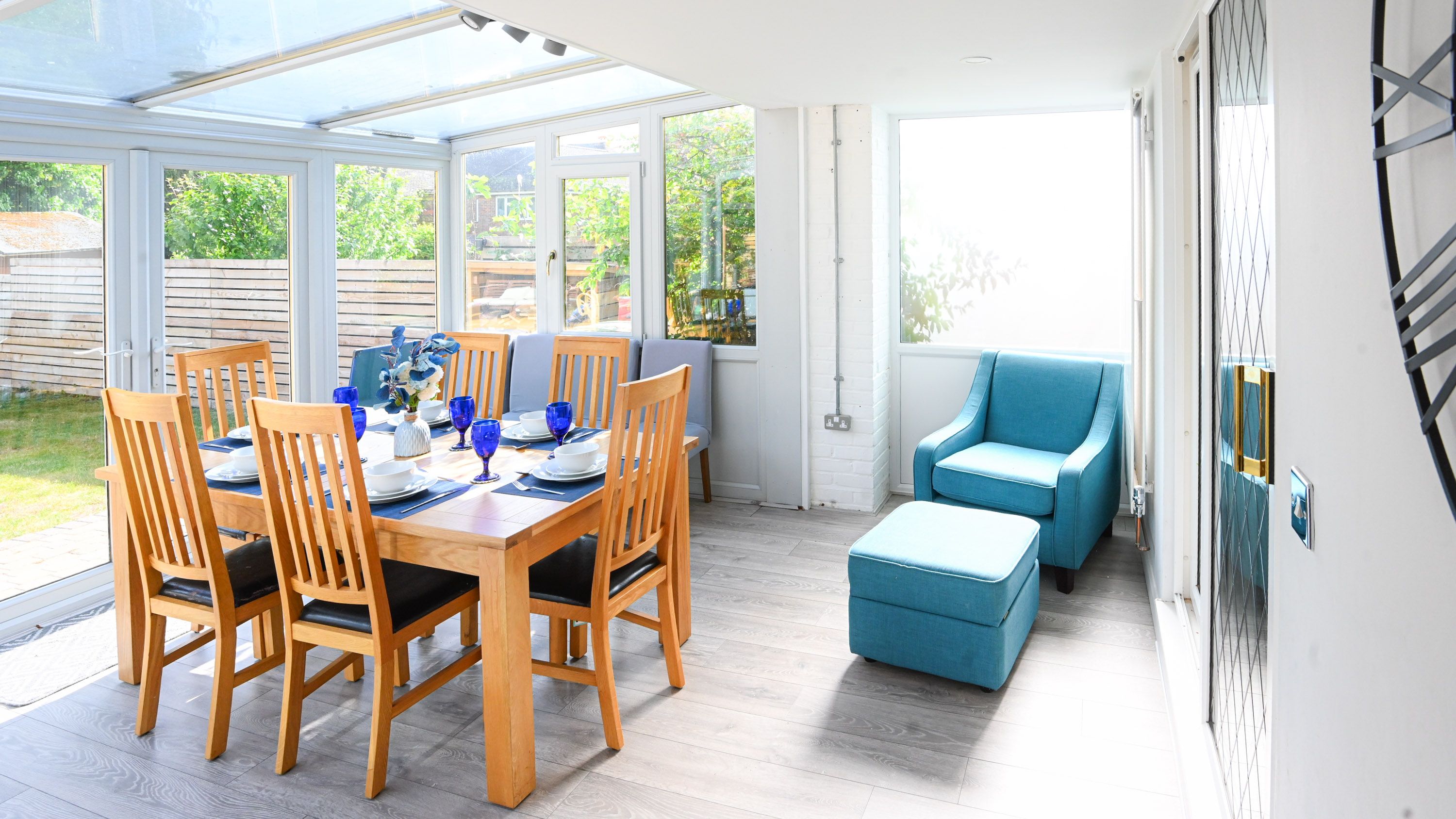 Bushmead House dining area with large windows and direct garden access.