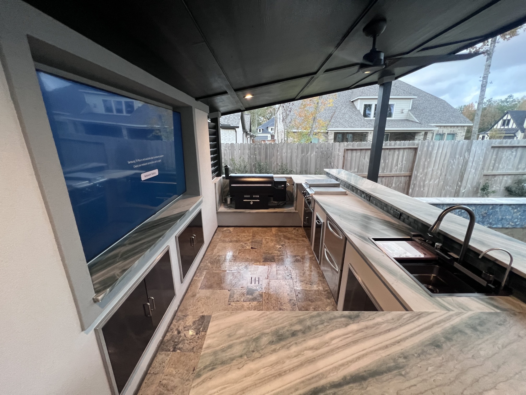 Luxury Outdoor Kitchen Adjacent to Custom Pool