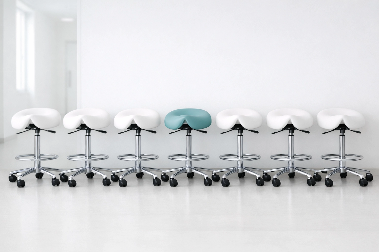 A unique teal chiropractic stool standing out among white ones, representing medical practice differentiation.