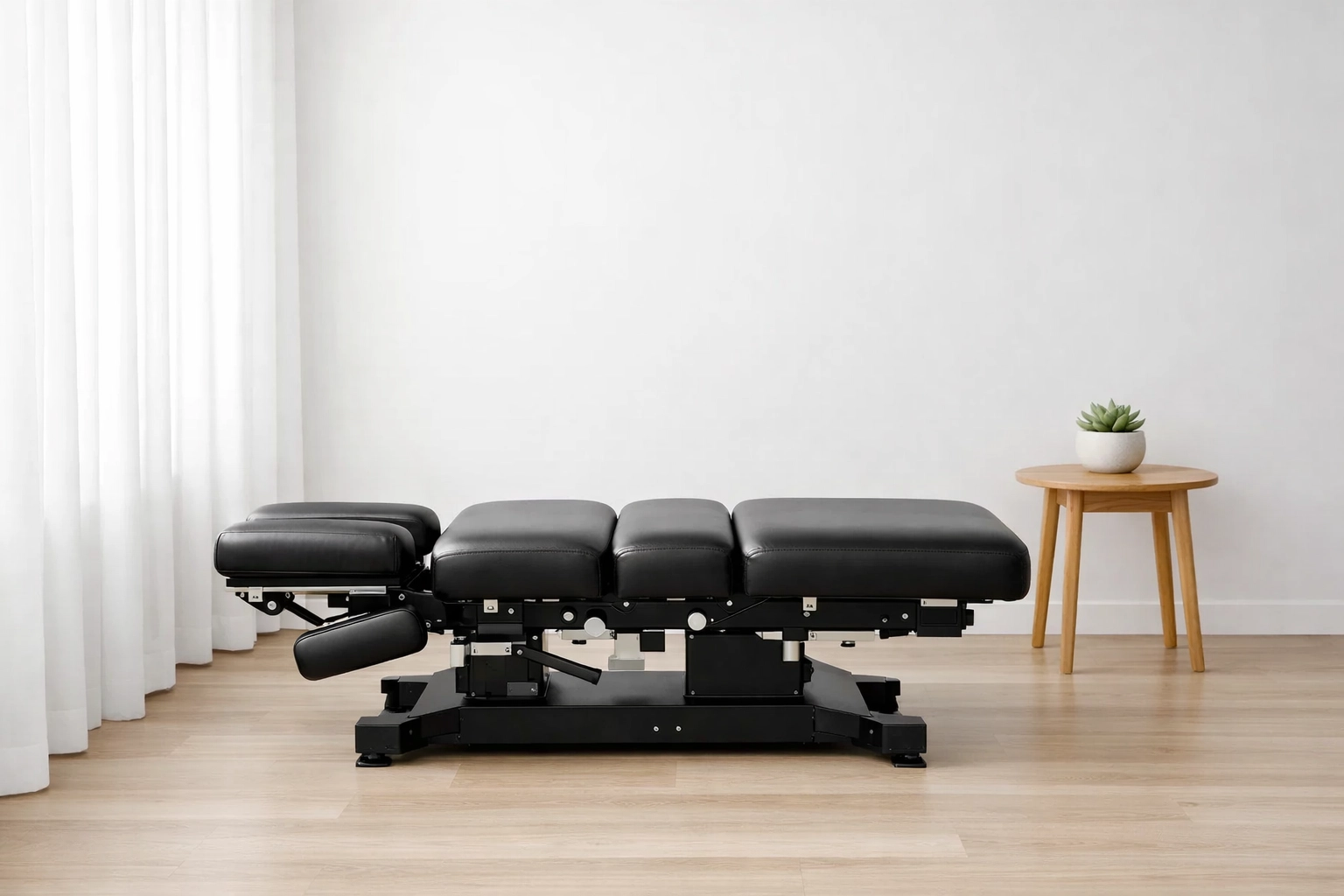 Clean, minimalist chiropractic adjustment room showcasing professional clinical standards for new patients.