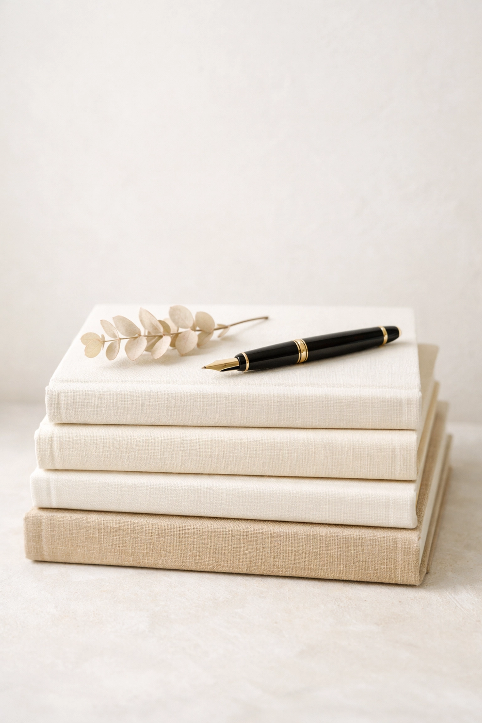 Textbooks and a fountain pen symbolizing academic success with an expert online chemistry tutor for Oxbridge.