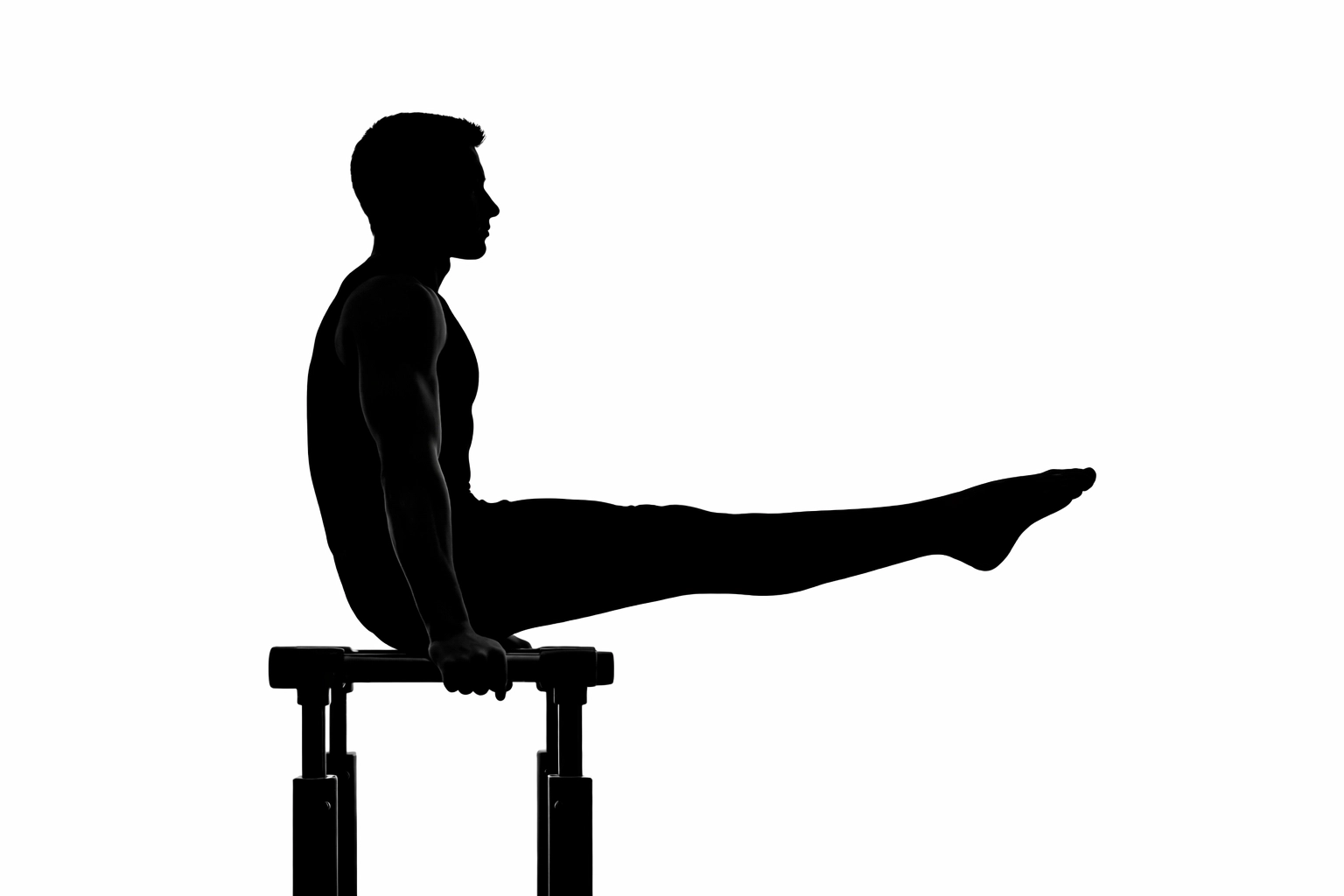 Elite athlete using calisthenics equipment for home workouts including an L-sit hold.