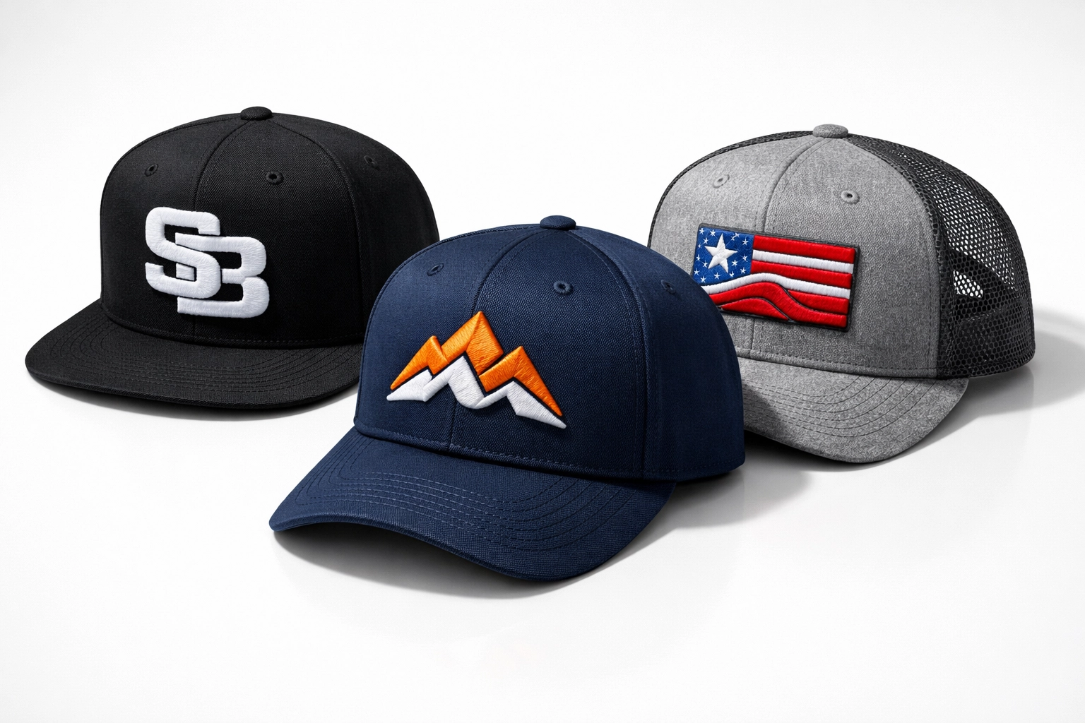 Three custom embroidered hats including a snapback and baseball cap from the Dallas business startup package.