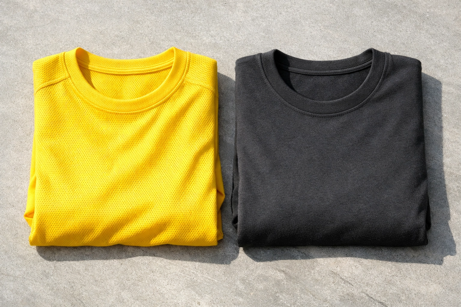Comparison of yellow performance fabric and grey ring-spun cotton for custom summer camp t-shirts.