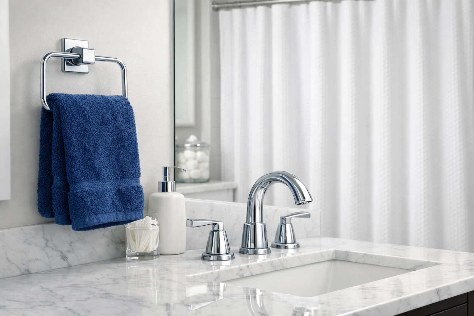 Sparkling master bathroom vanity and towels showcasing professional weekly house cleaning in Stow MA.