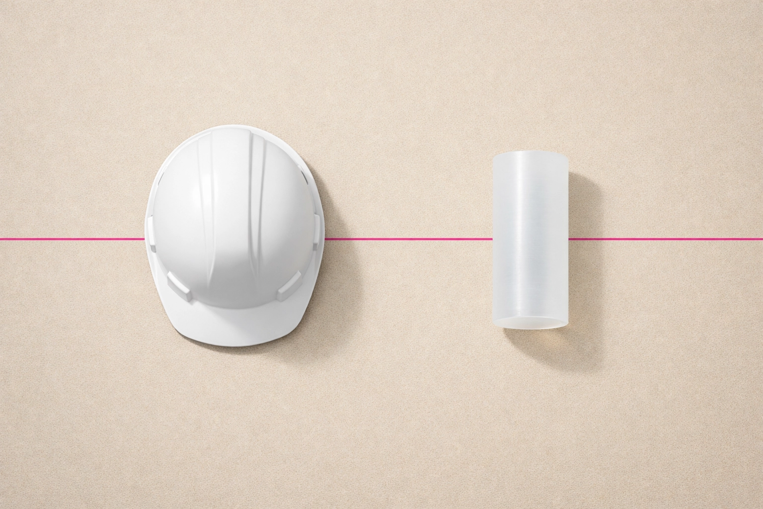 Industrial HDPE plastic waste and a safety hard hat ready for circular recycling on a construction site.