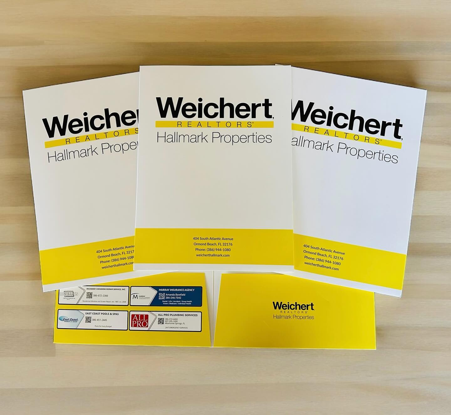 Custom-branded presentation folders for Weichert Realtors Hallmark Properties