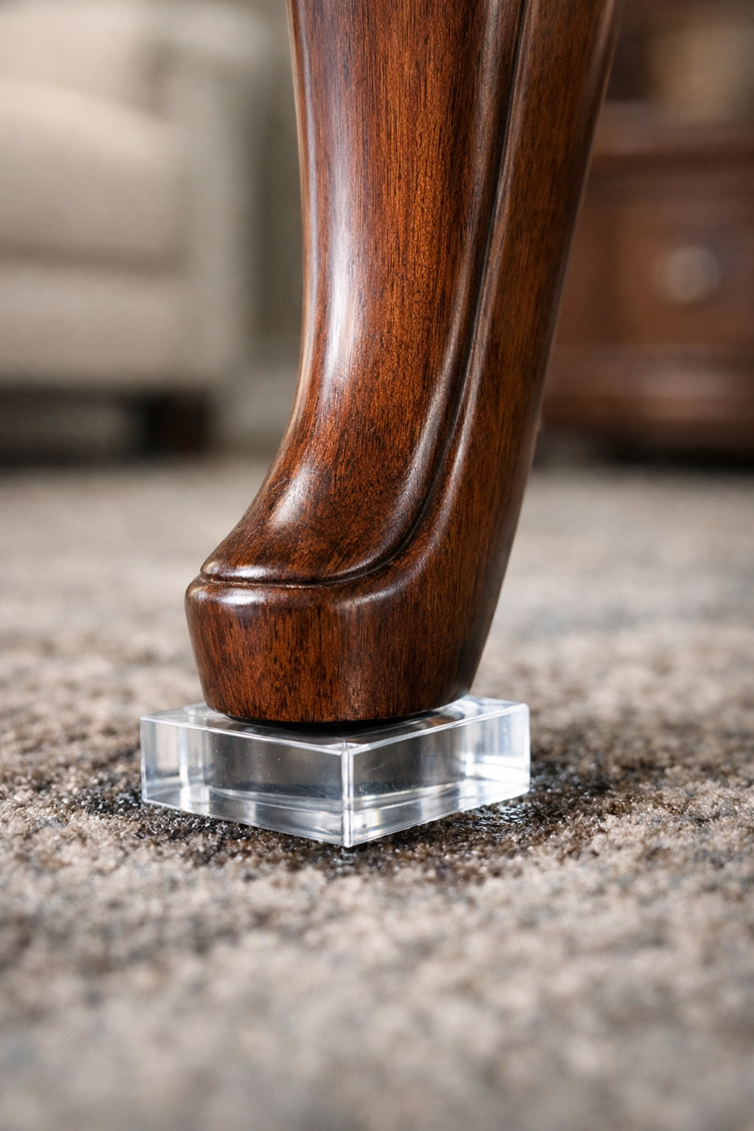 Protecting furniture on wet carpet with blocks to avoid staining during carpet cleaning and restoration.
