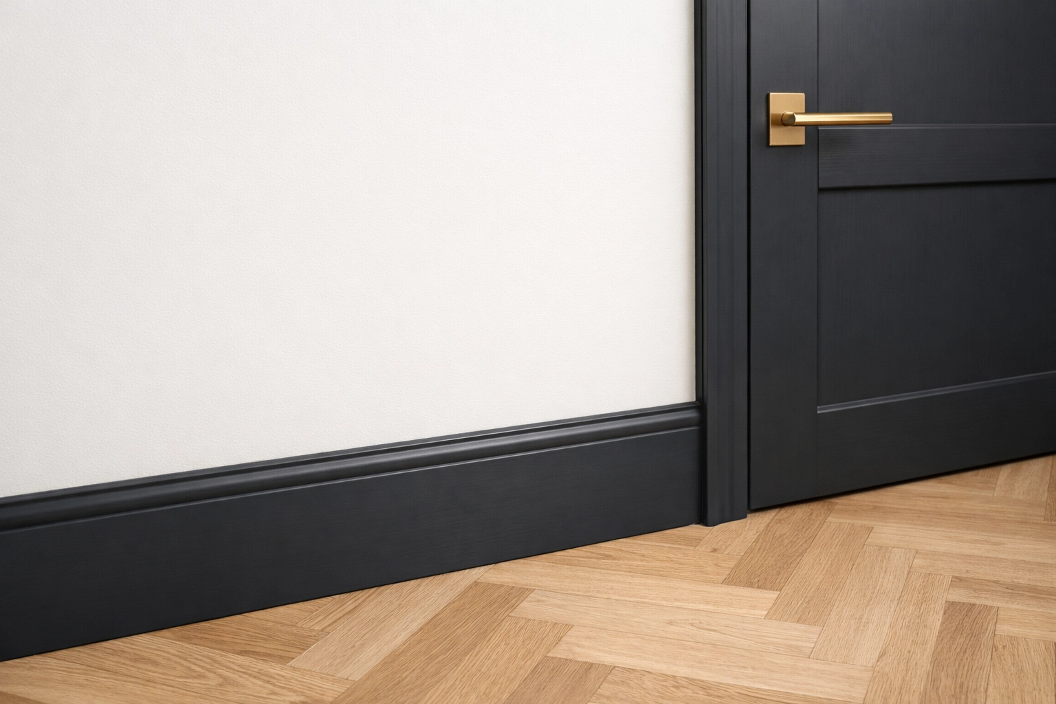Charcoal grey skirting boards and a matching dark door in a modern Cheltenham hallway.