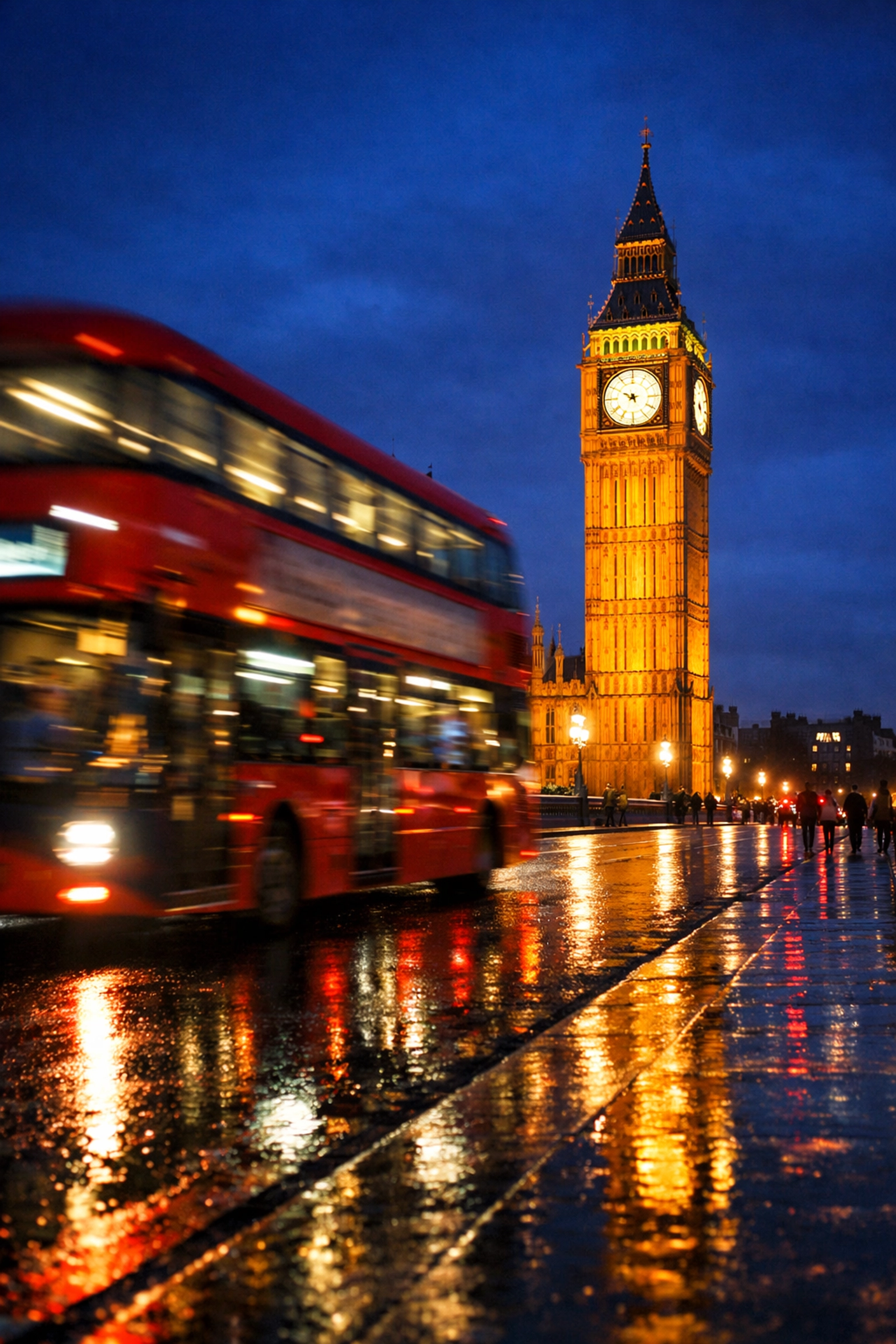 Night photography of London's Big Ben and a red bus on Westminster Bridge, perfect for travel photography tips.