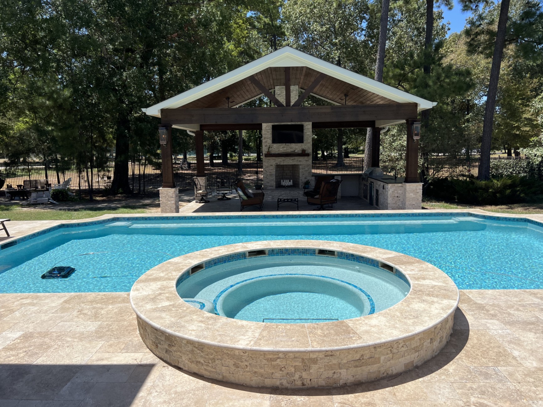 Complete outdoor living space with luxury pool and custom landscaping