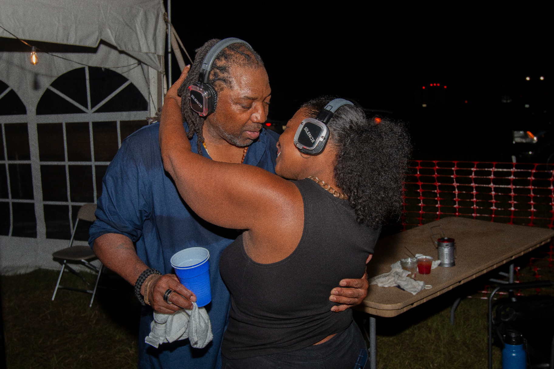 Two campers dancing at a silent party