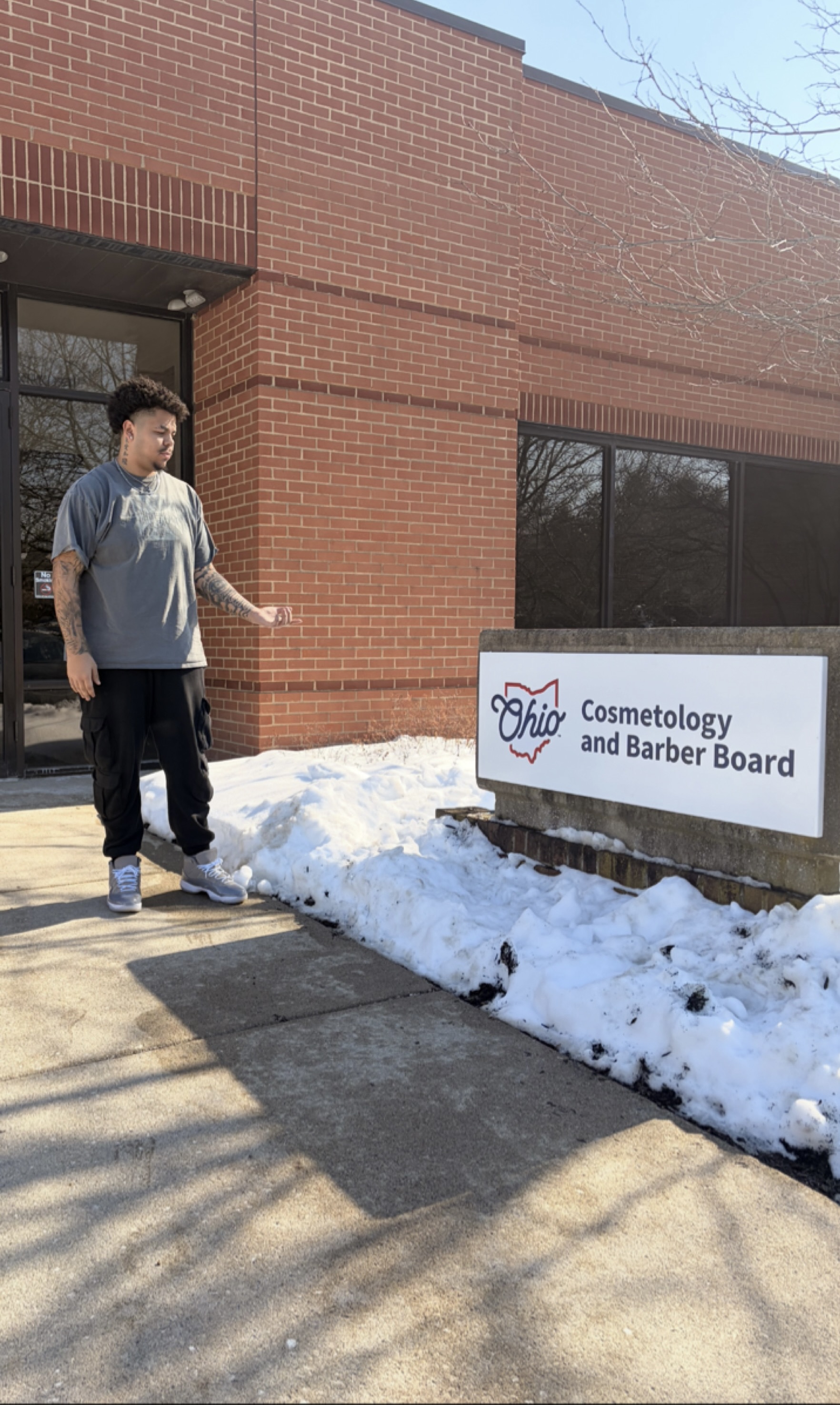 Jeremiah Collins, X-Quisite Cutz School of Barbering graduate, after passing the Ohio State Board Exam.