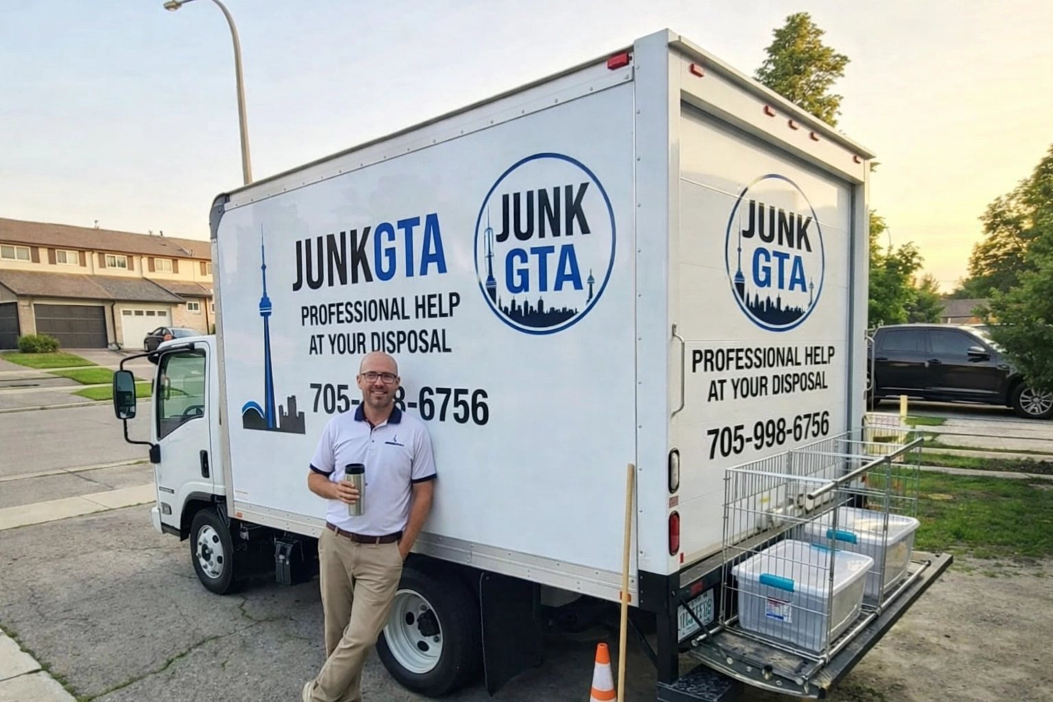 Junk GTA team member beside truck ready for a scheduled junk pickup in a residential neighborhood