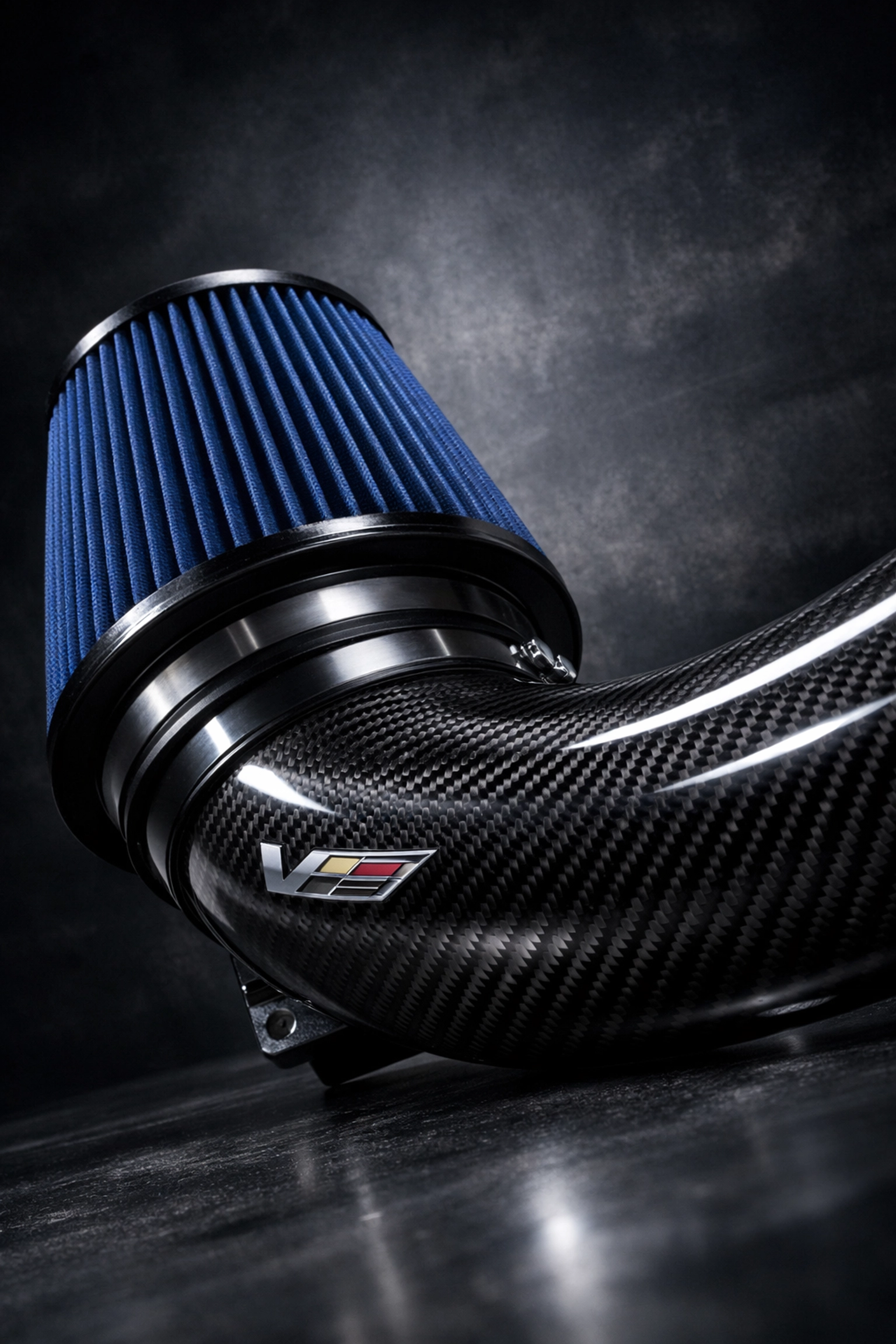 High-performance carbon fiber cold air intake for Cadillac CTS-V with blue high-flow filter.