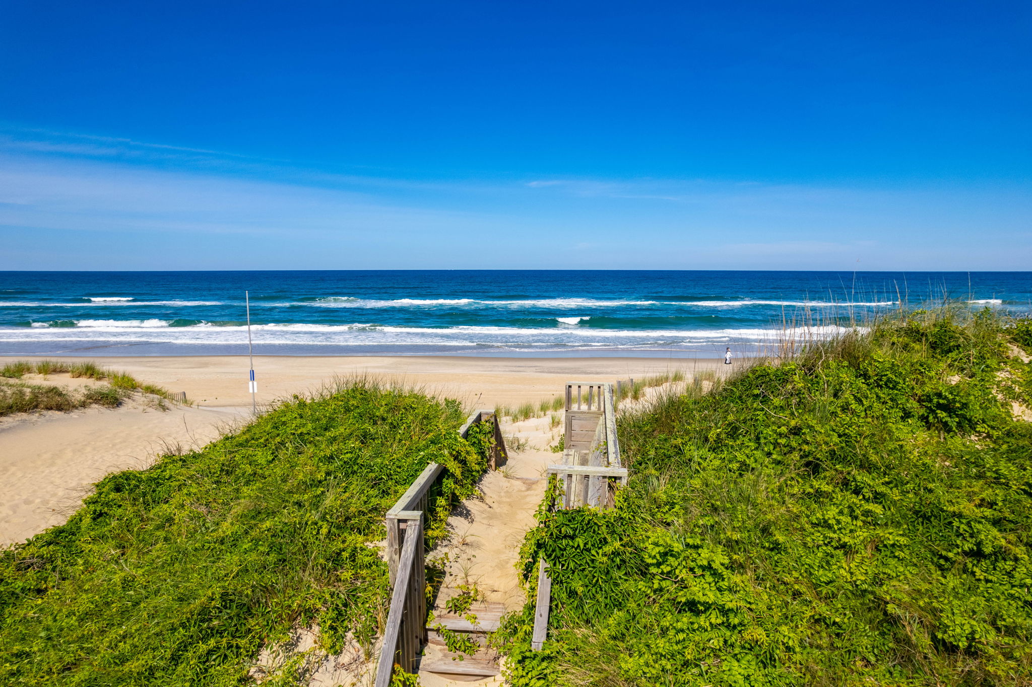 Private dune walkover A walkway leading directly to a pristine sandy beach Private dune walkover A walkway leading directly to a pristine sandy beach