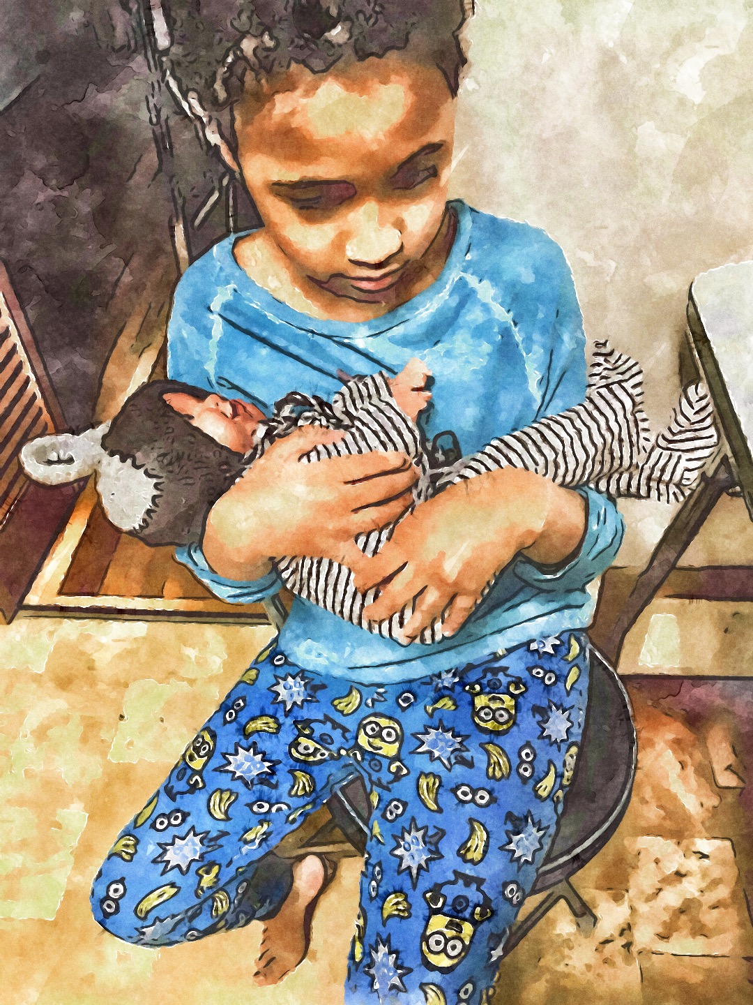 A young child gently cradling a newborn sibling indoors, highlighting family bonding