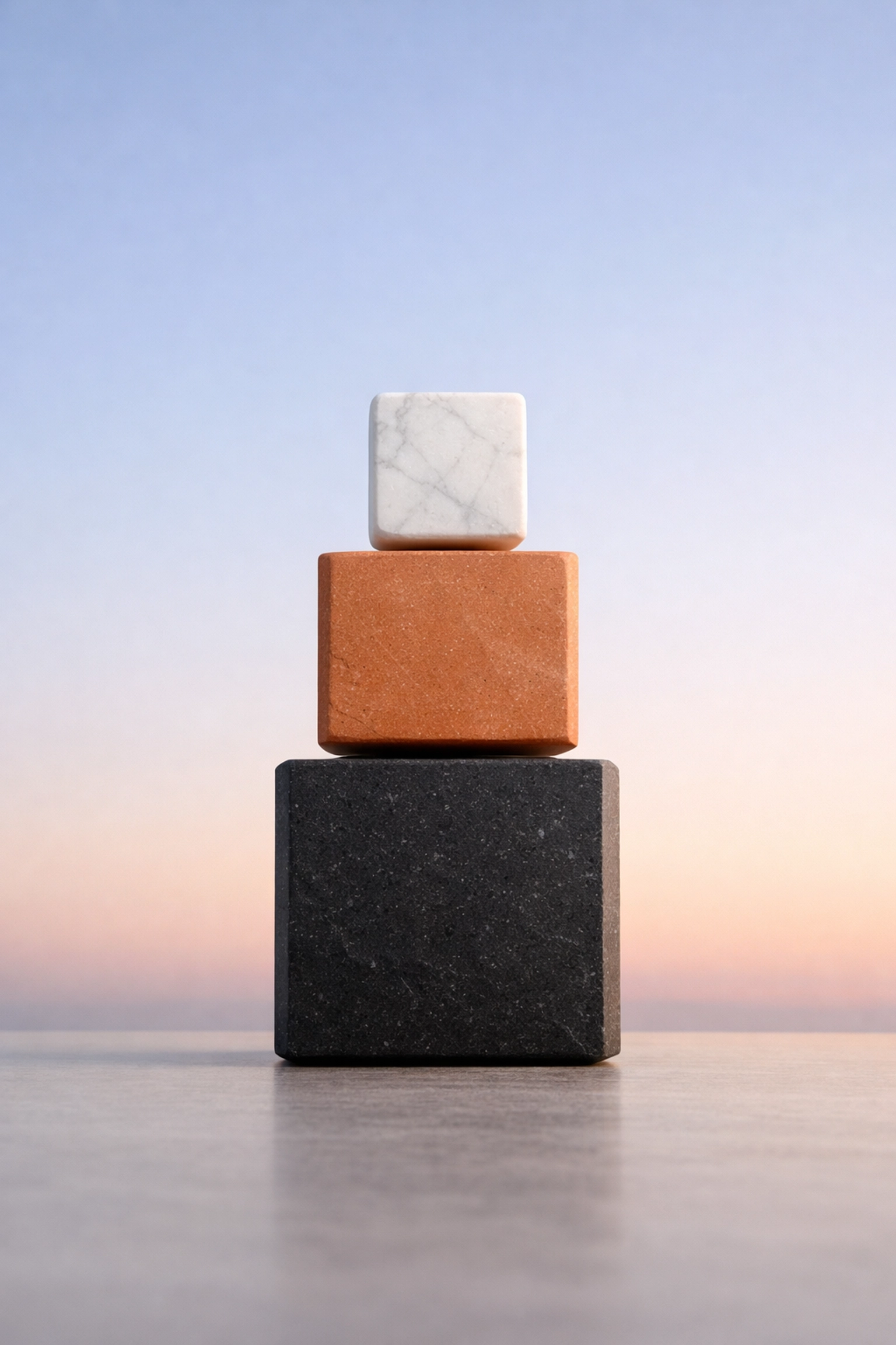 Three stacked stone blocks symbolizing the balanced structure of the 50/30/20 budgeting system.