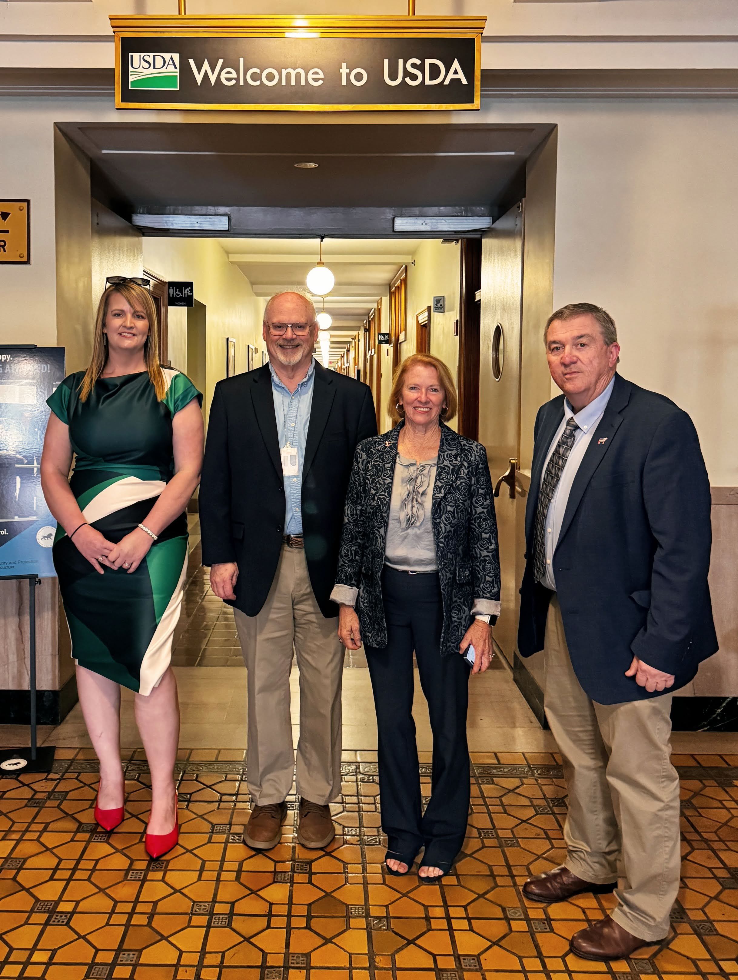 LEA Board members Brittany Scott, Bob Bishop, Renee Strickland, and Tony Clayton at the USDA entrance