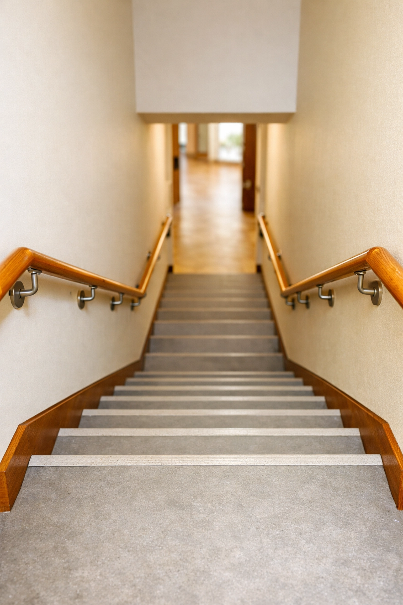 Sturdy wooden handrails installed on both sides of a staircase for extra support and fall prevention.