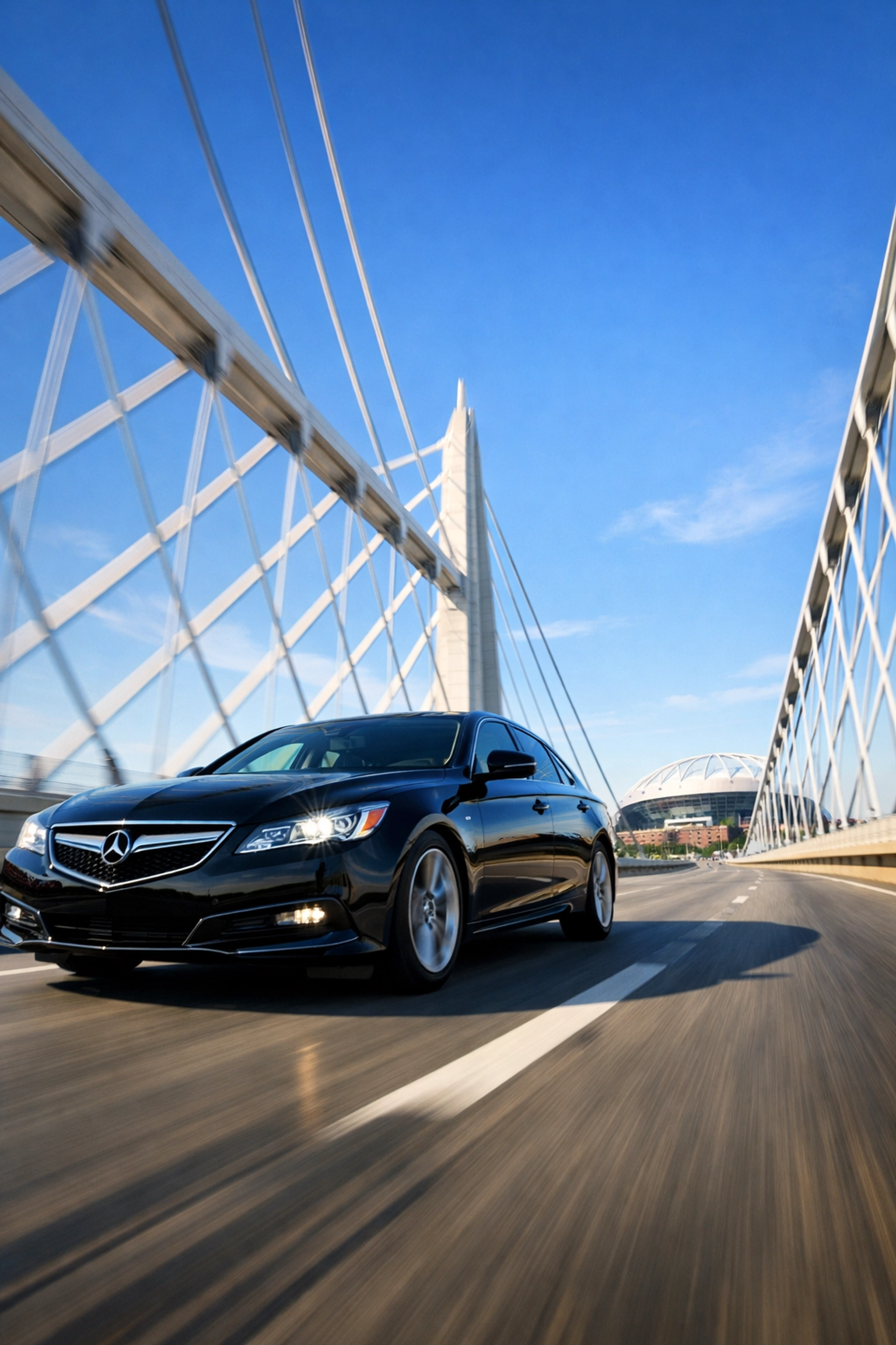 Black luxury sedan driving across a bridge, representing seamless ground transportation for Super Bowl travel.