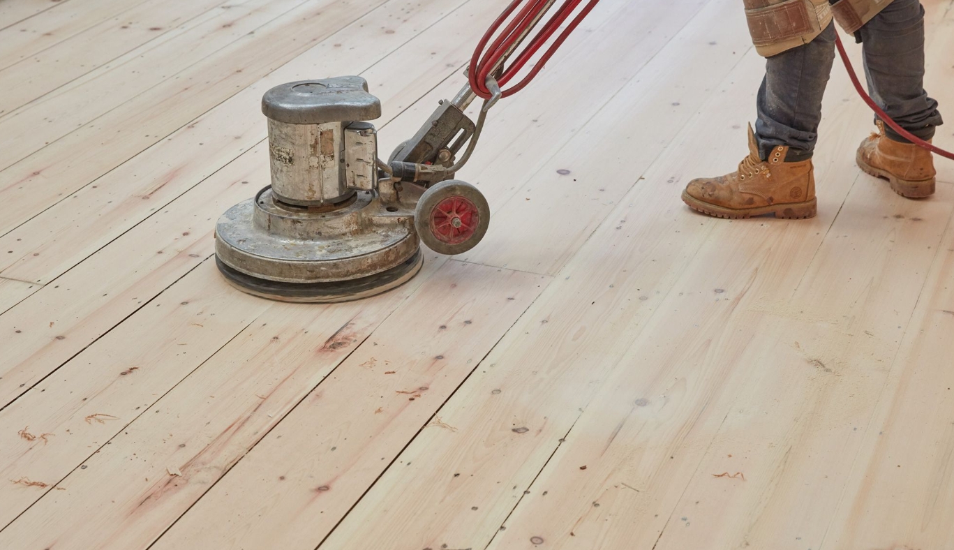 Hardwood floor refinishing in progress