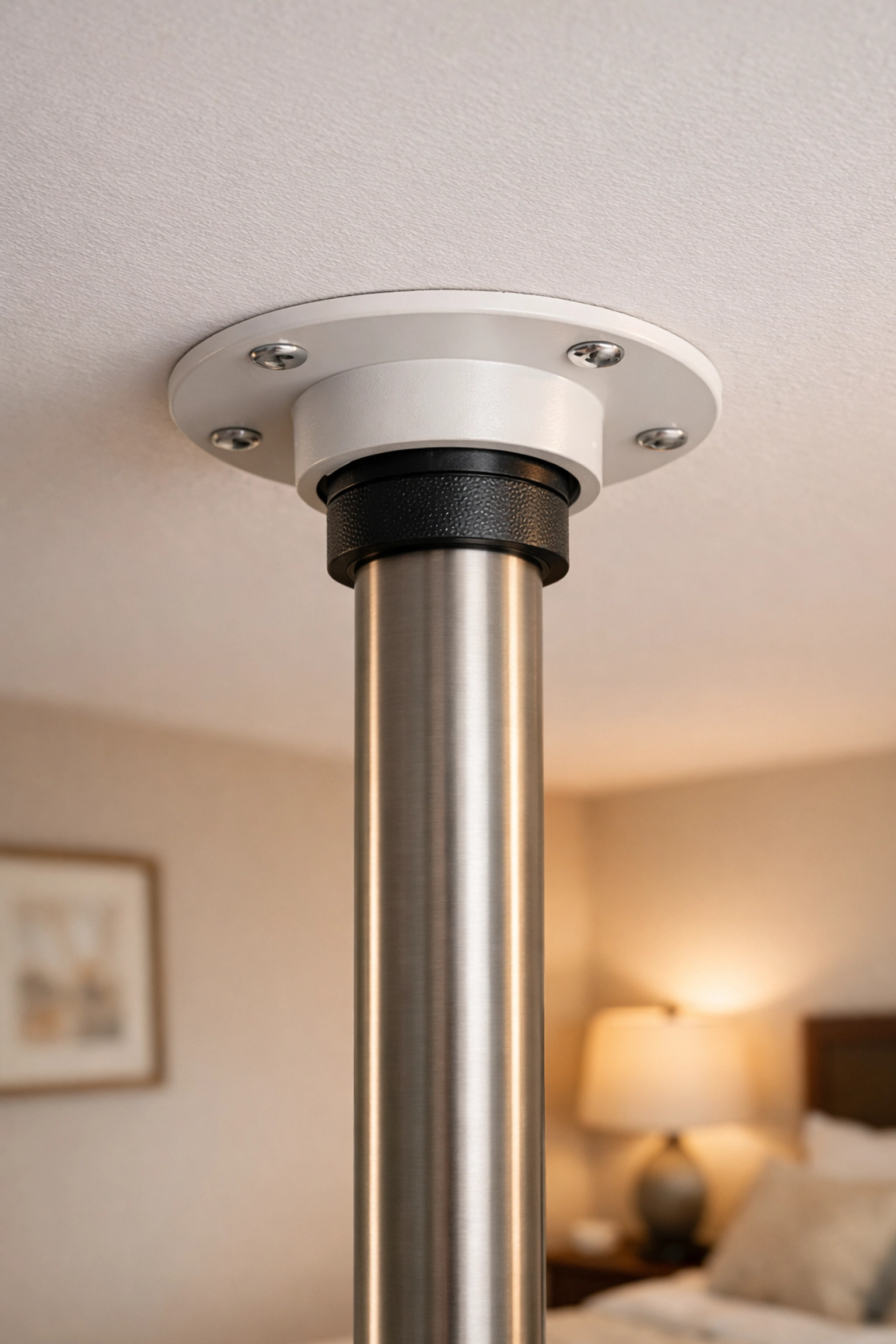 Secure transfer pole ceiling plate mounted against a flat surface for stability.