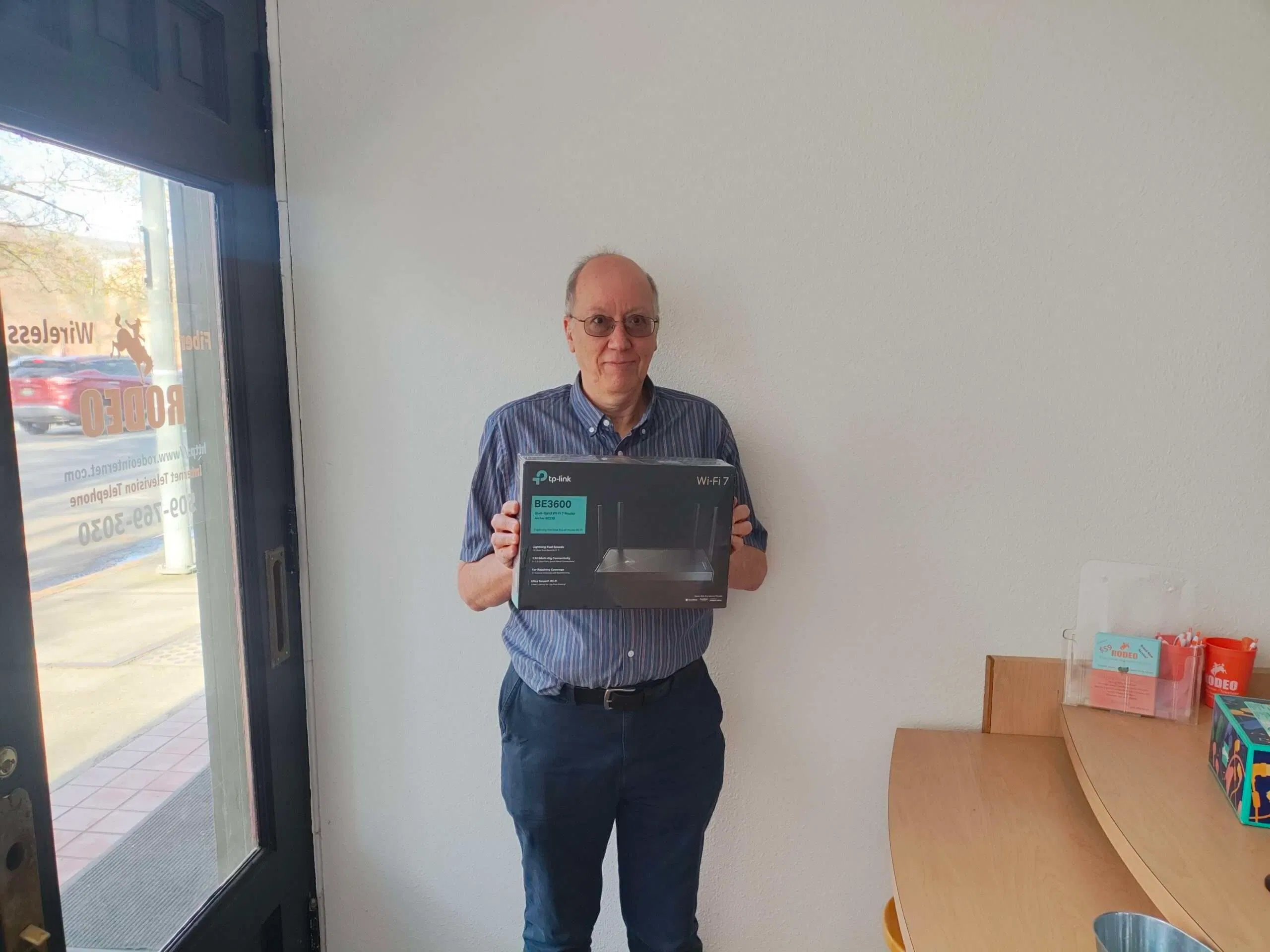 Rodeo Networks customer at the Lewiston office with the latest Wi-Fi 7 equipment