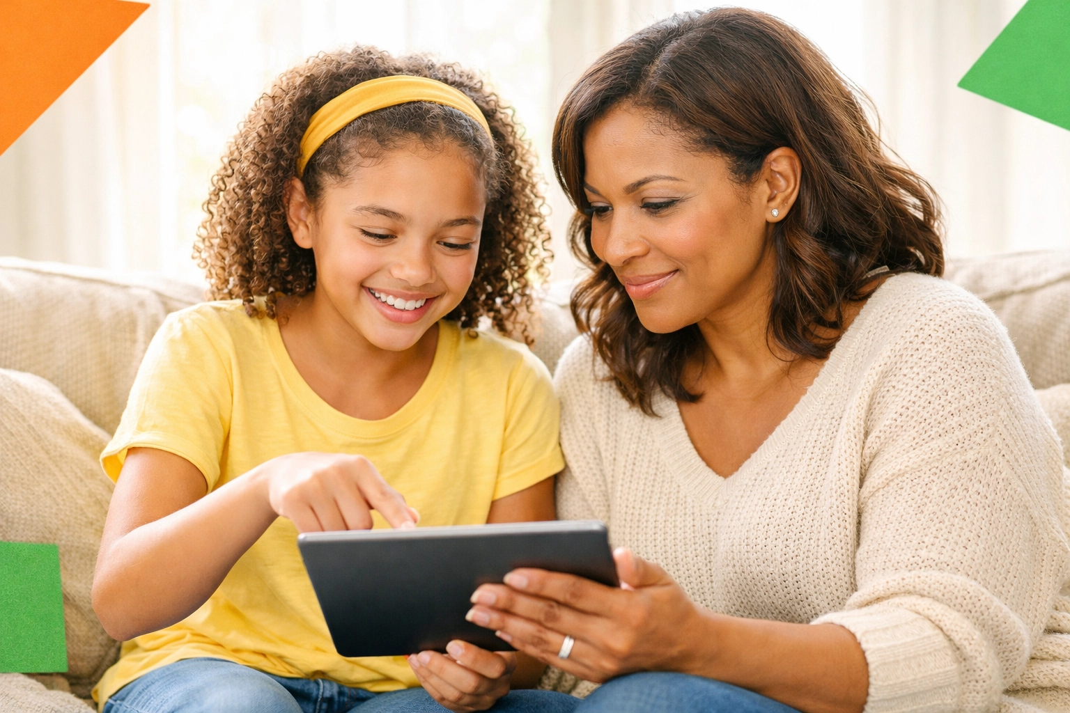 Mother and daughter having conversation about online safety with tablet